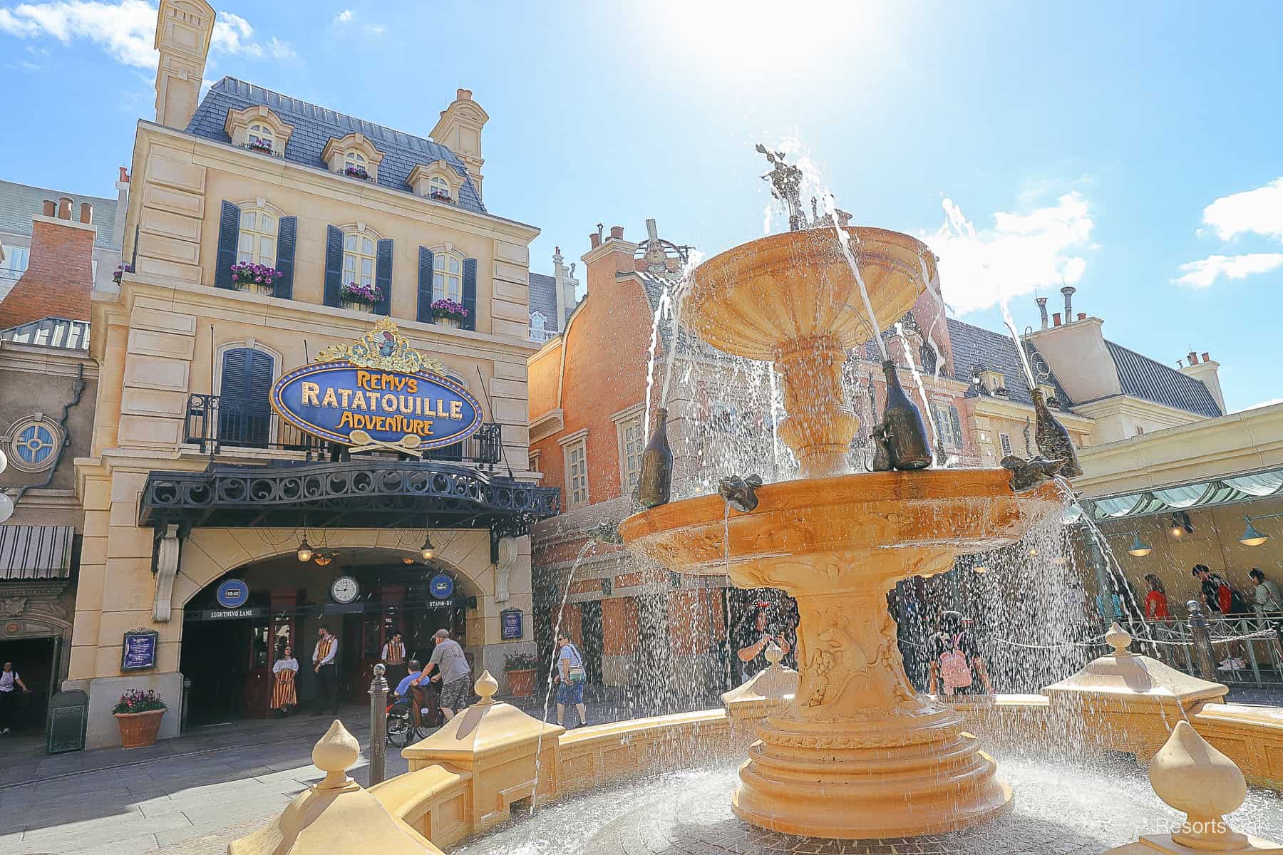 a fountain in front of Remy's Ratatouille Adventure at Epcot 