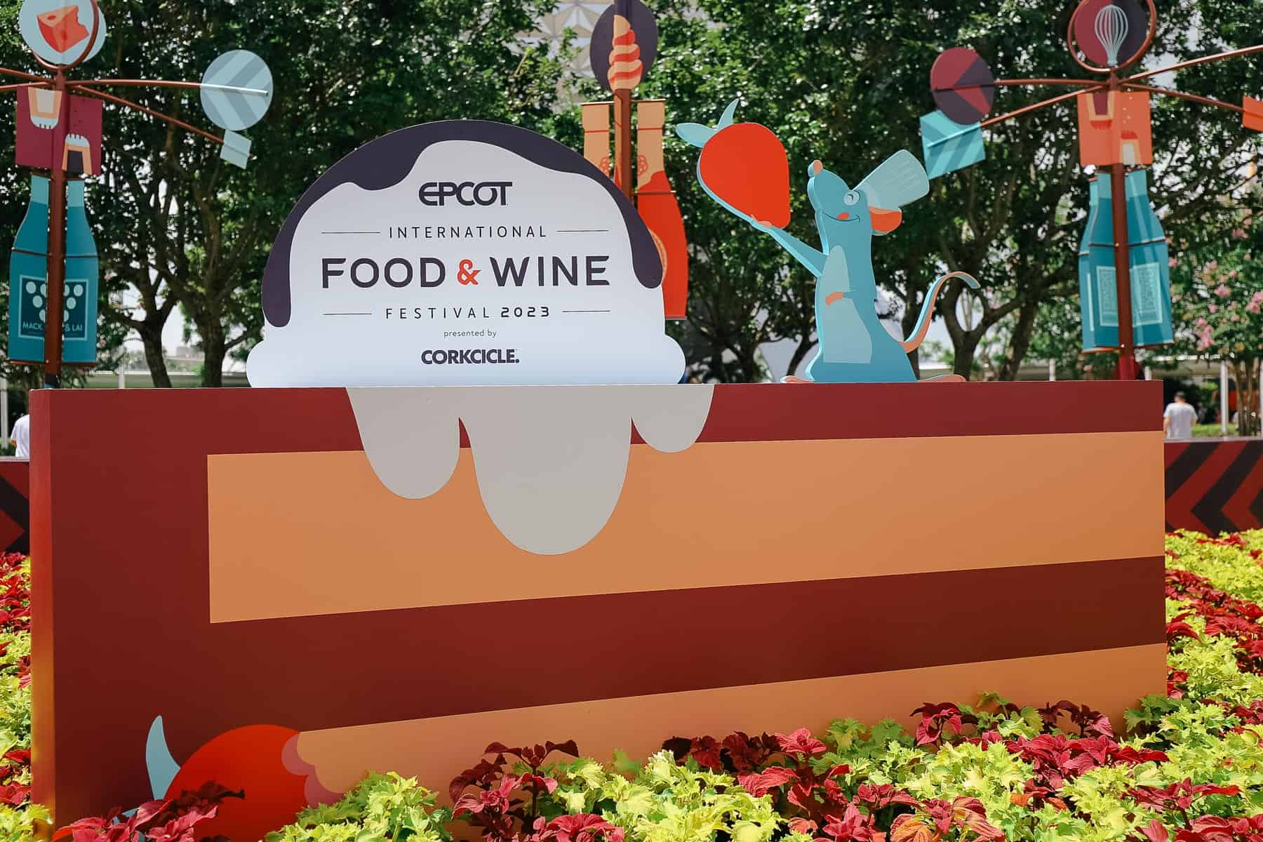 a display featuring a giant slice of cake at Epcot's Food and Wine Festival 