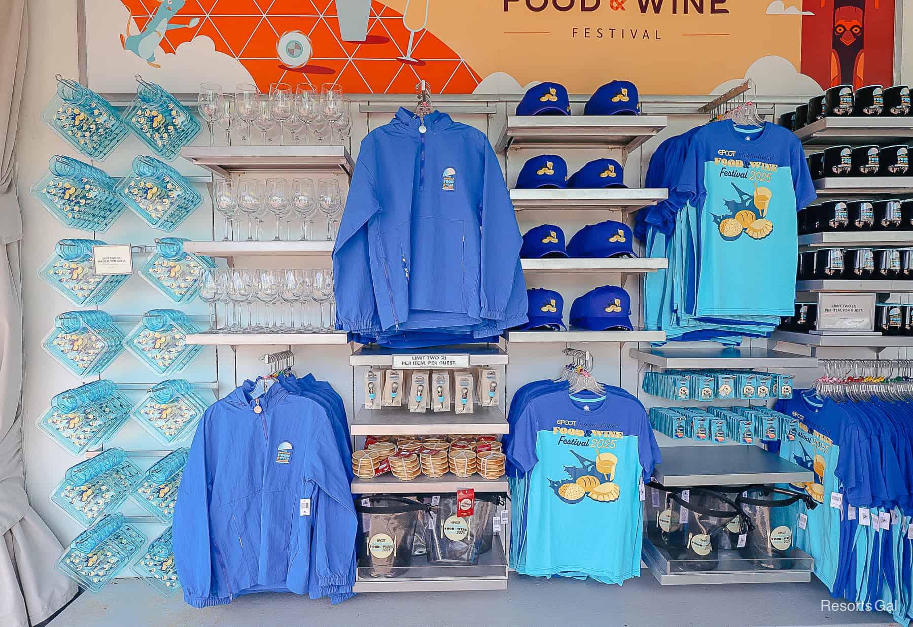 a display showcasing the 2025 Epcot International Food and Wine Festival logo collection merchandise