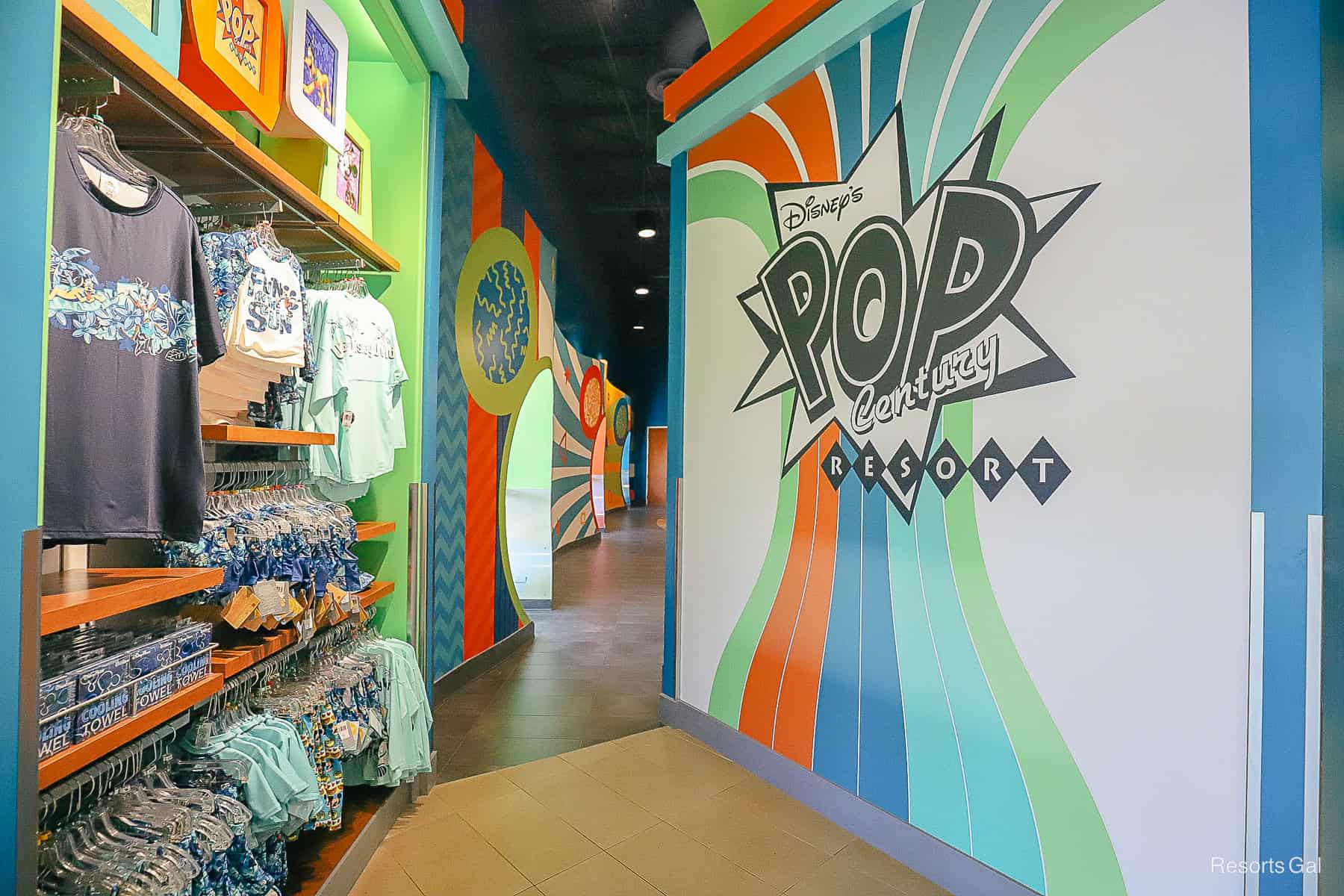the resort bus stop entrance to Disney's Pop Century with an updated mural featuring the resort's logo 