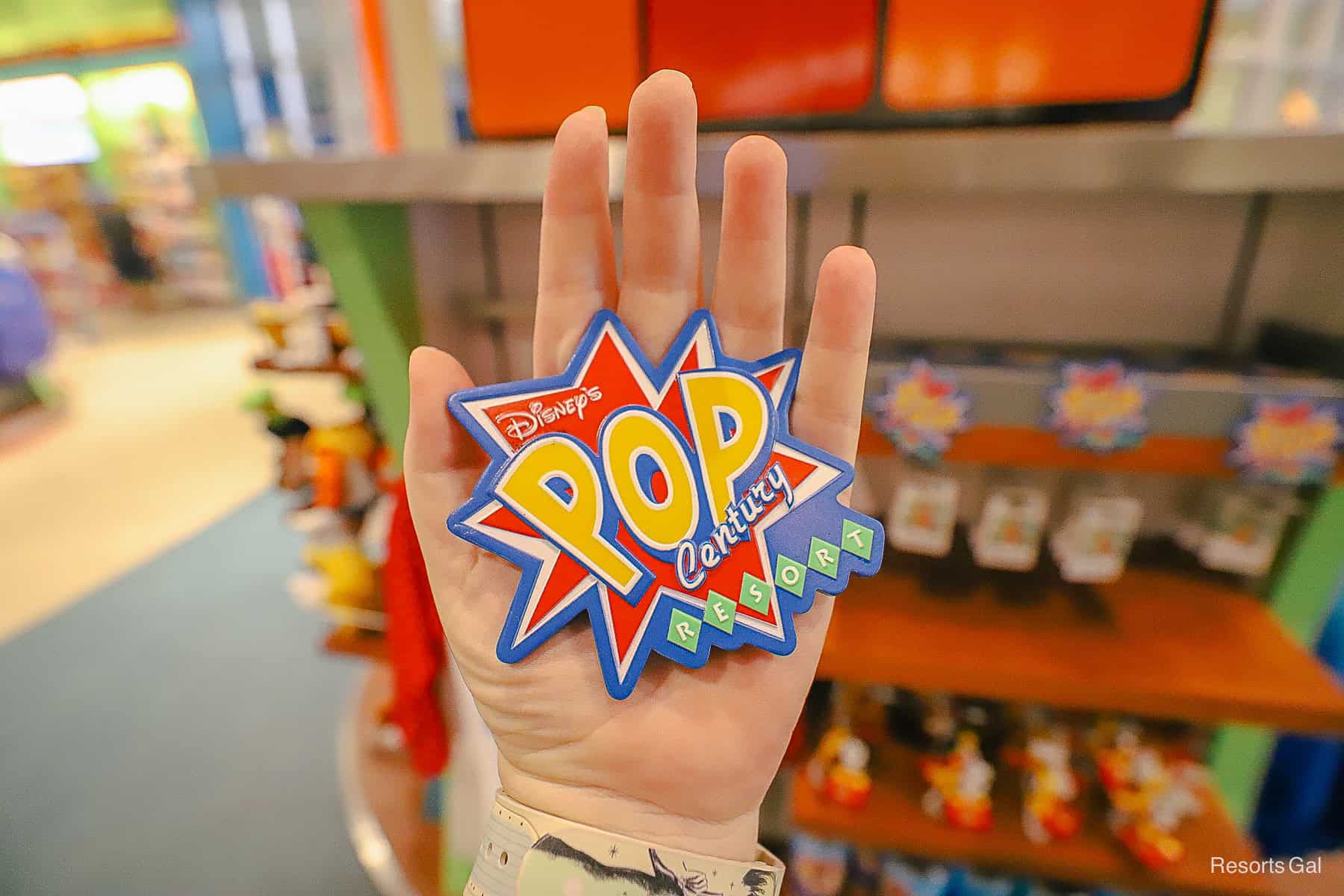 a Pop Century Resort magnet in red, yellow, blue, and green 