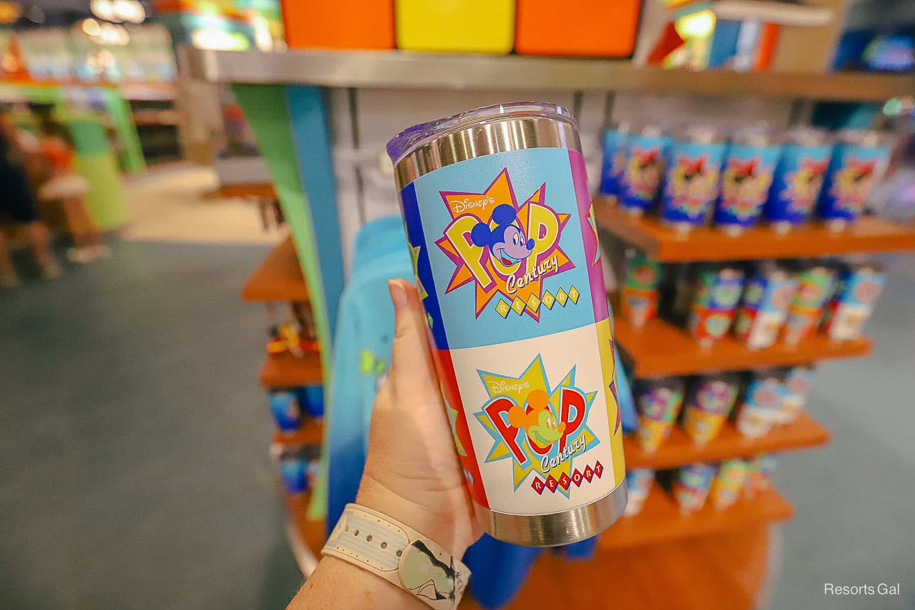 one side of the Pop Century tumbler with white and blue squares 