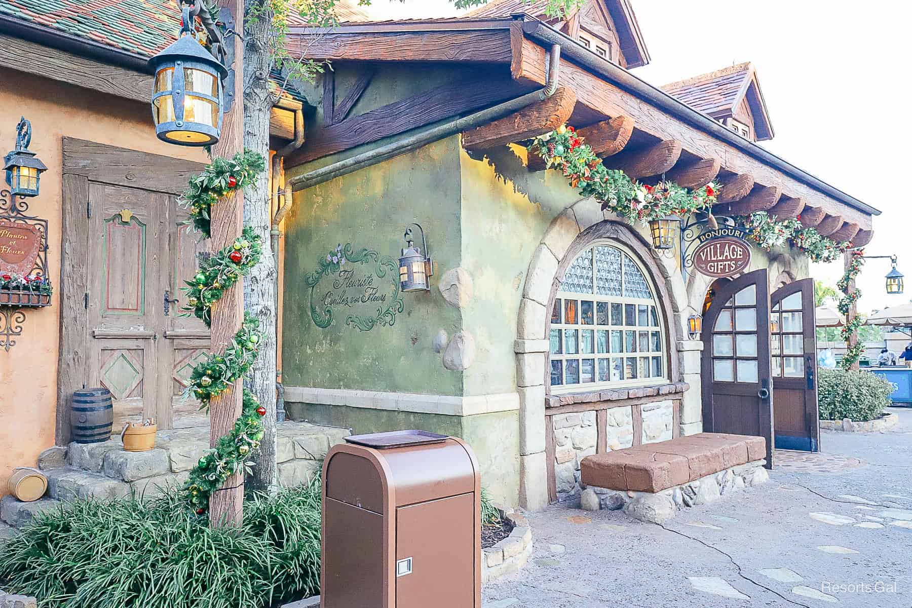 garland decorates Bonjour Village Gifts in Fantasyland 