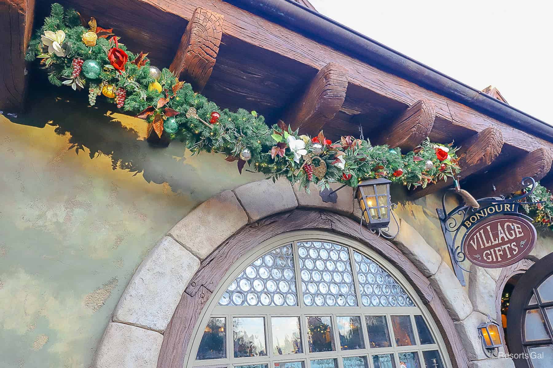 the festive garland with greens and reds on Bonjour Village Gifts 