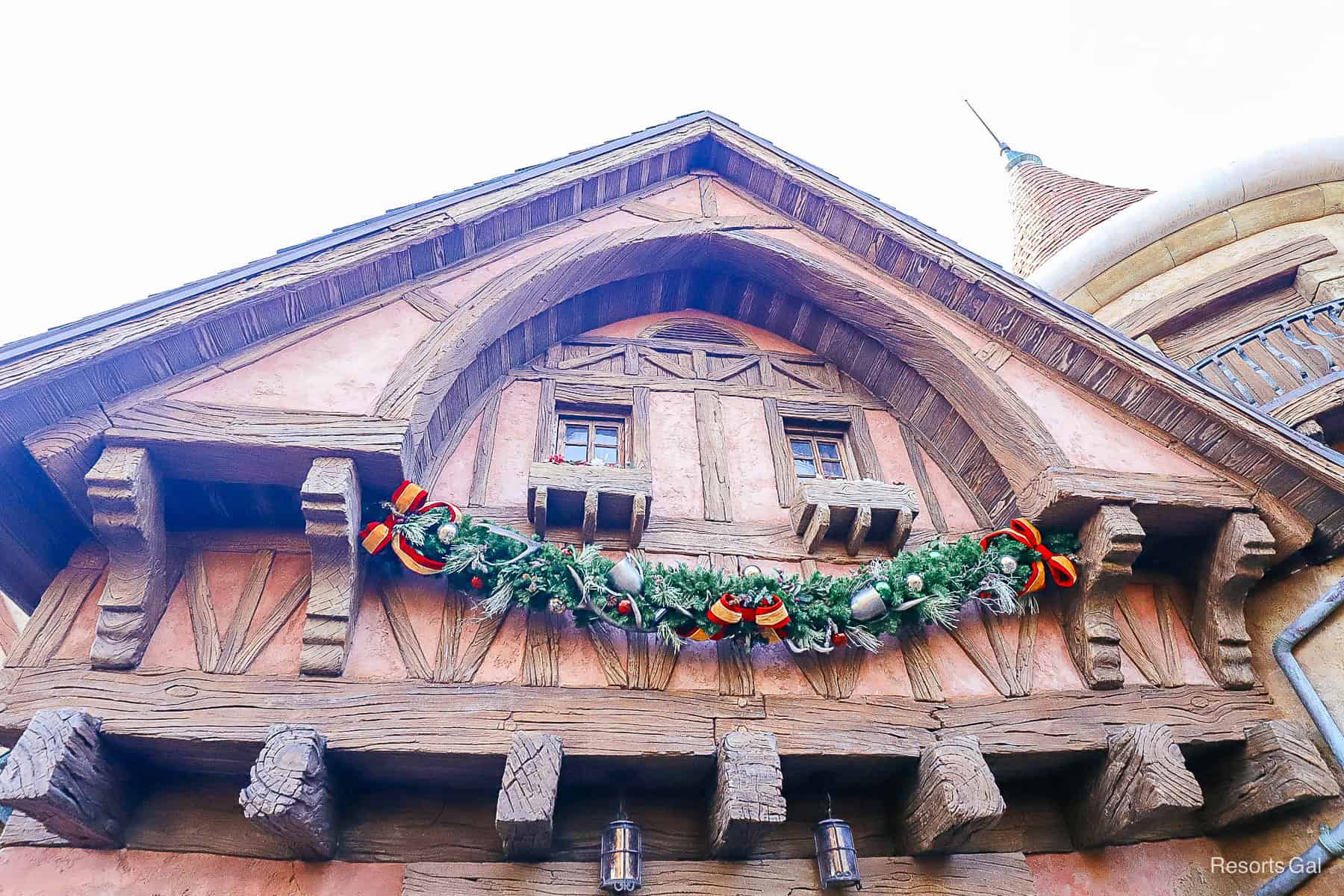 red and gold ribbons with sterns in the garland over Gaston's tavern 
