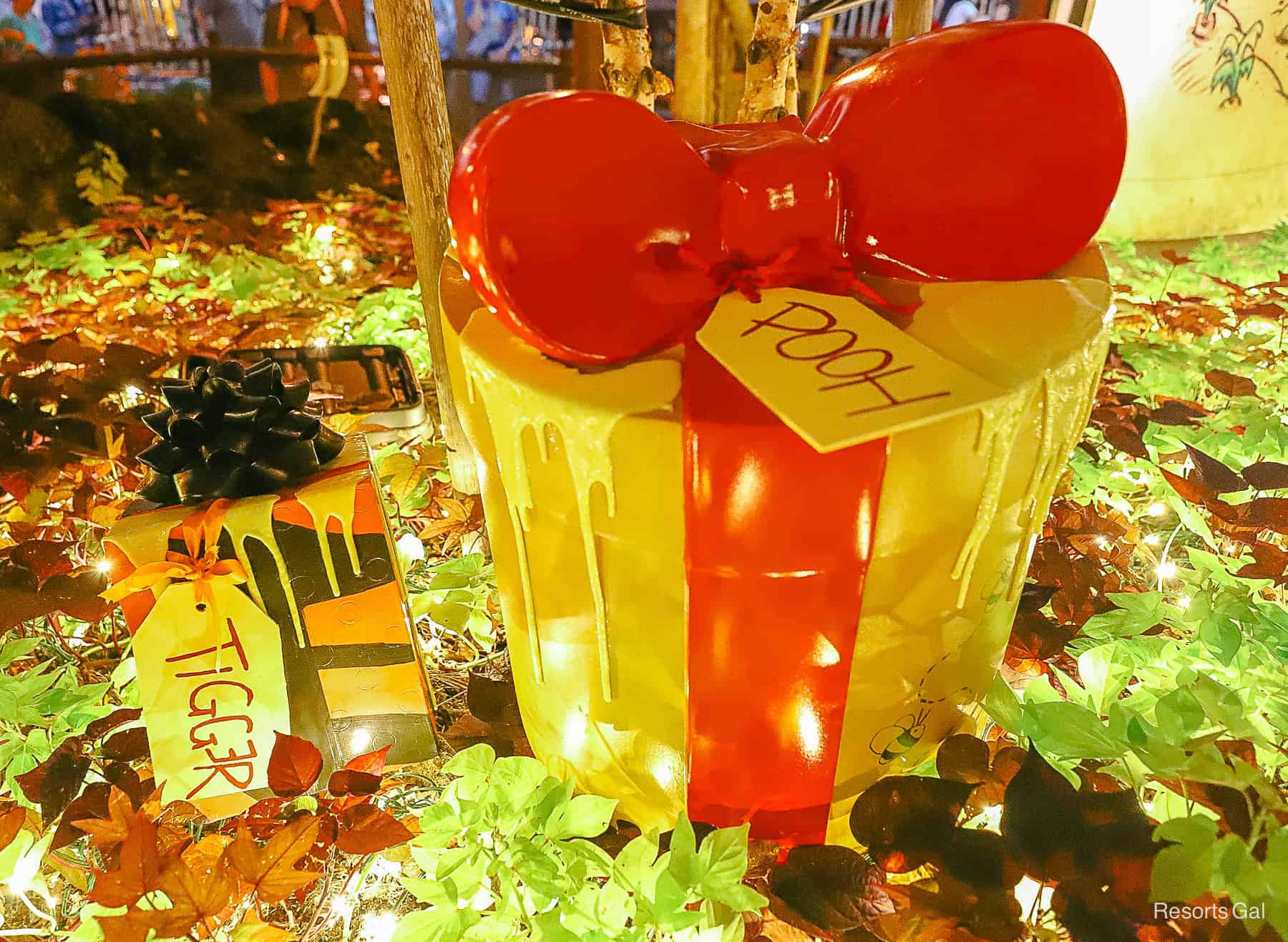 a box for Pooh with a red bow that's oozing with honey. Tigger also has a bright box 