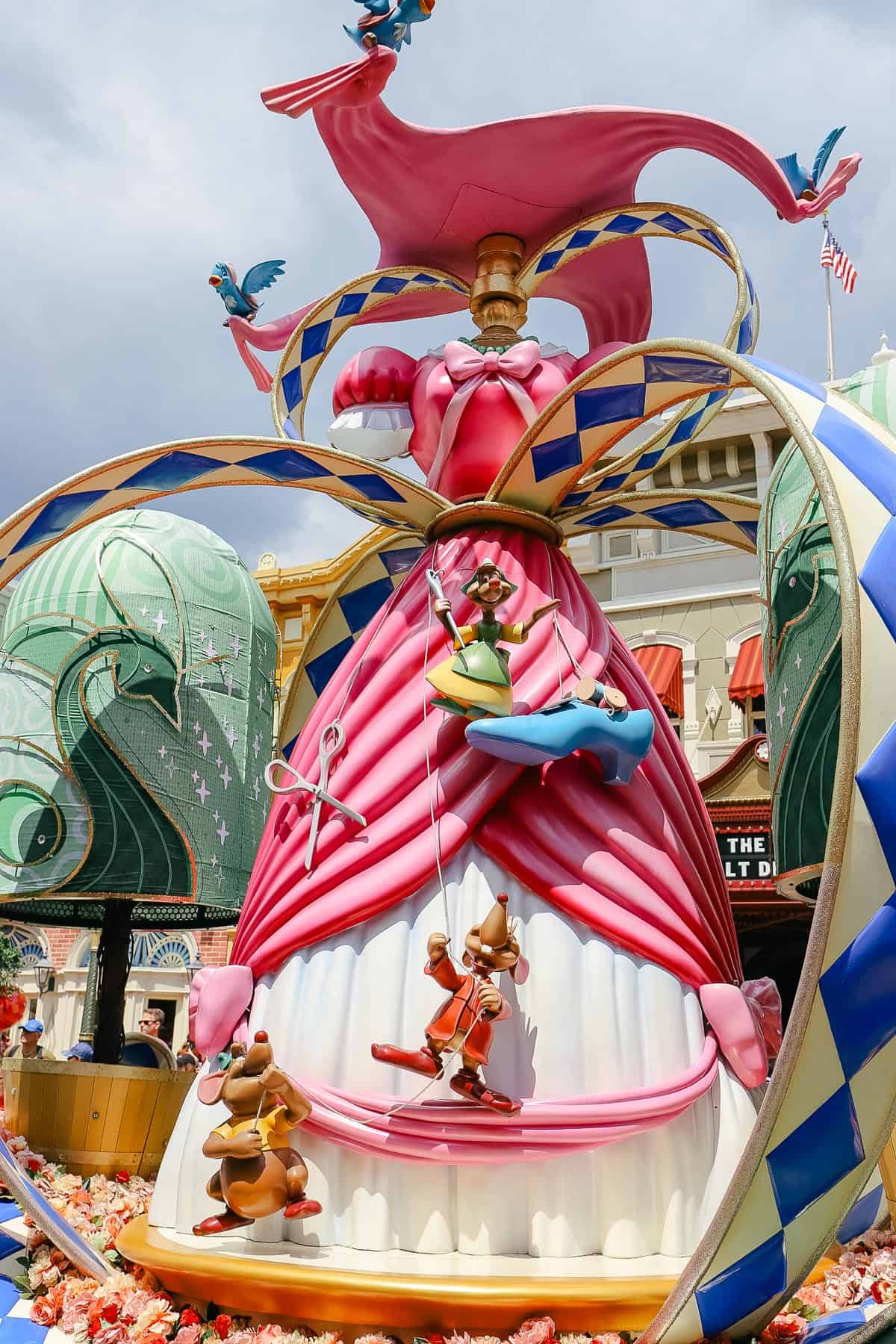 Cinderella's mice are working on her ballgown on one side of the Cinderella float. 