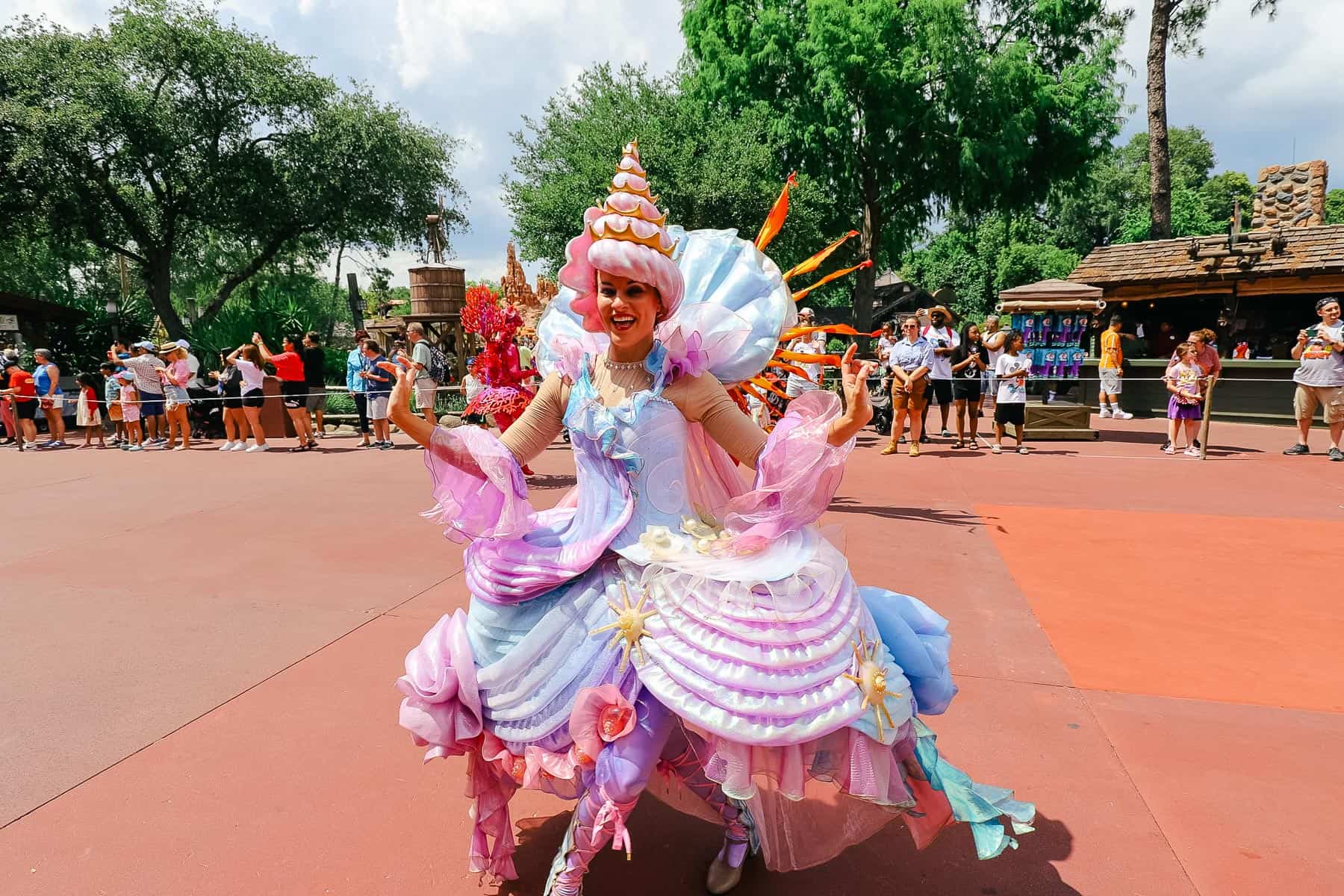 A performer dressed as a seashell in the parade. 