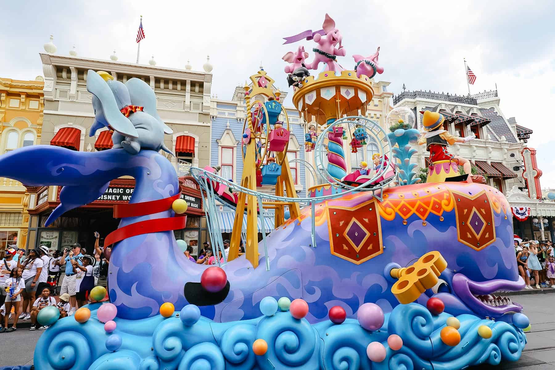 Dumbo rides on the whale's tail in the parade at Magic Kingdom. 