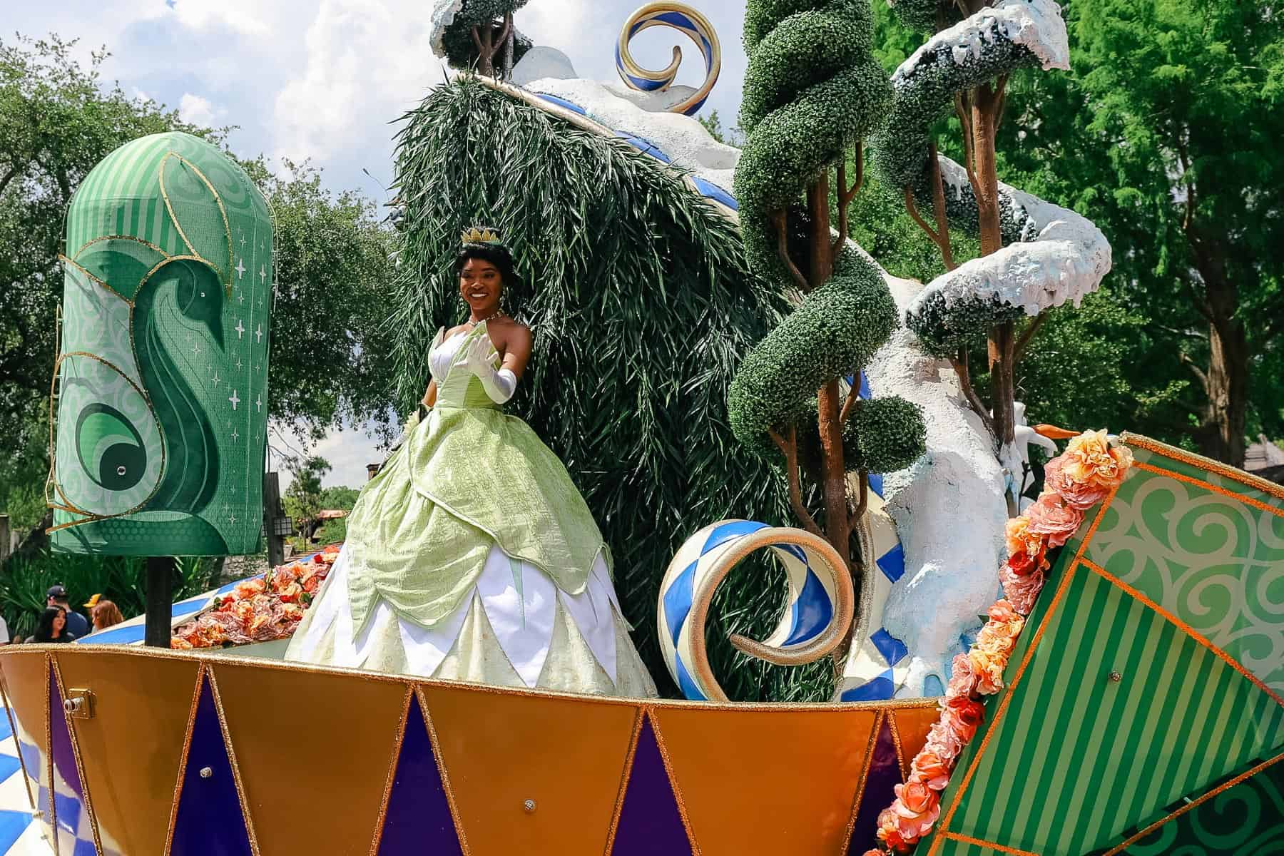 Princess Tiana toward the back of the Festival of Fantasy Princess float. 
