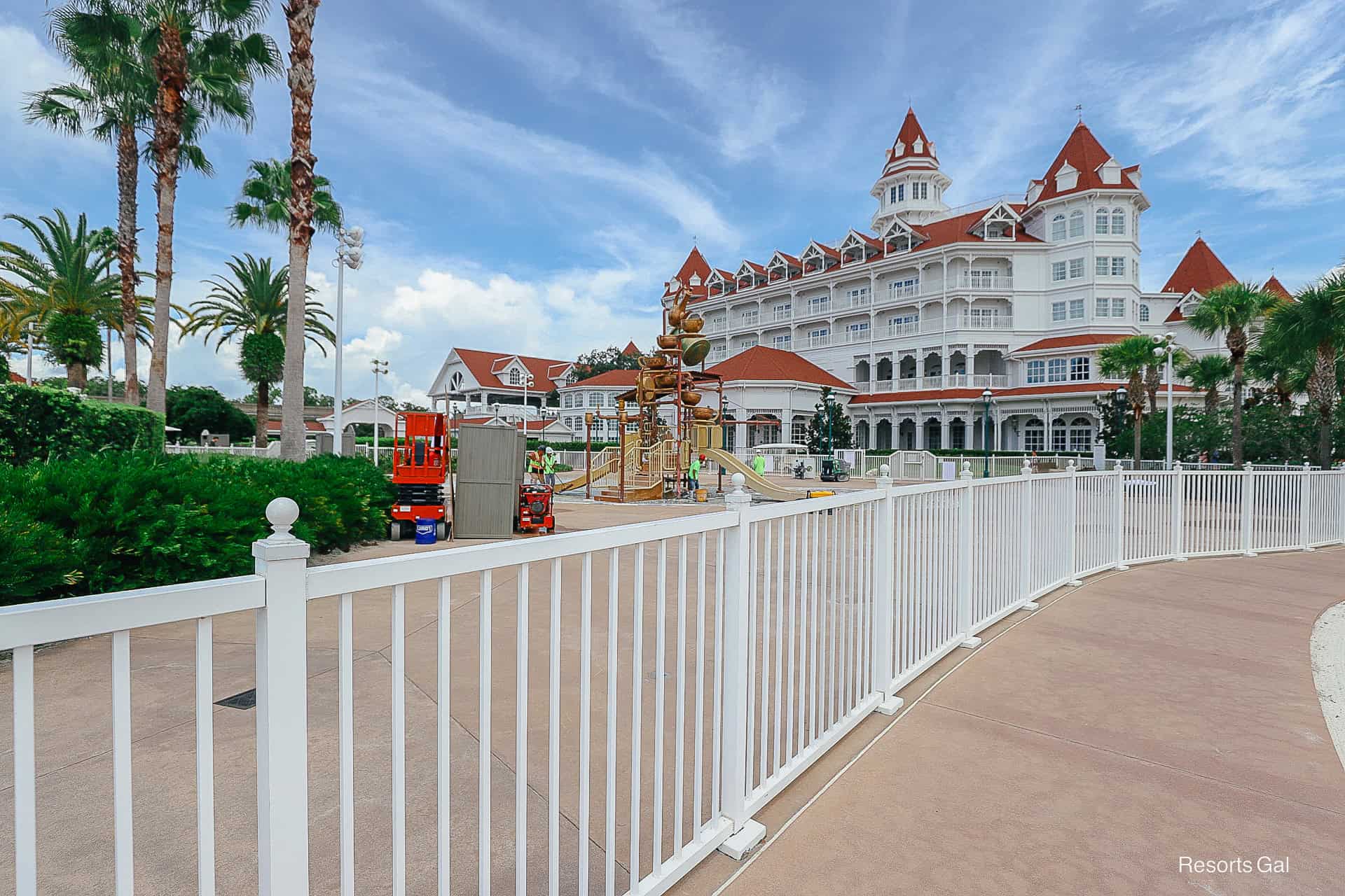 construction workers resurfacing the flooring of the splash pad area at Disney's Grand Floridian 