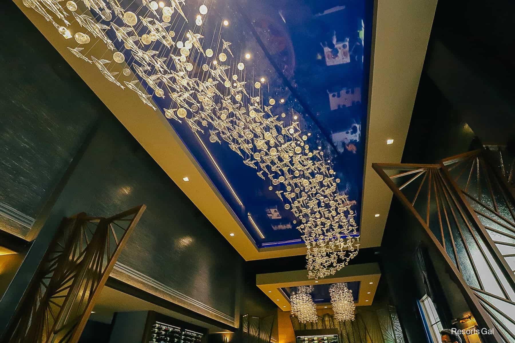 a light fixtures made of glass resembling Flying Fish 