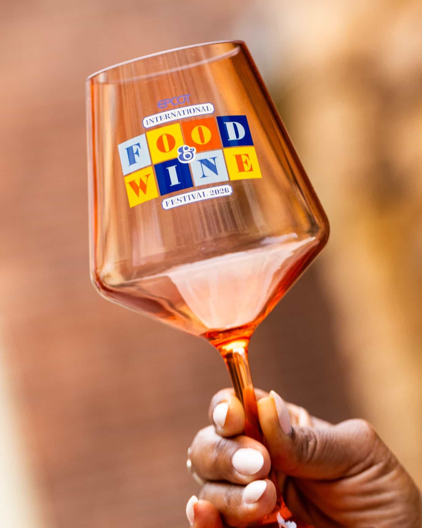 a wine glass with the Epcot Food and Wine logo