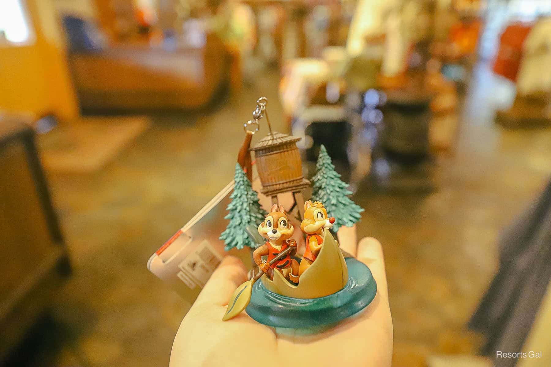 an ornament with Chip and Dale in a paddle boat