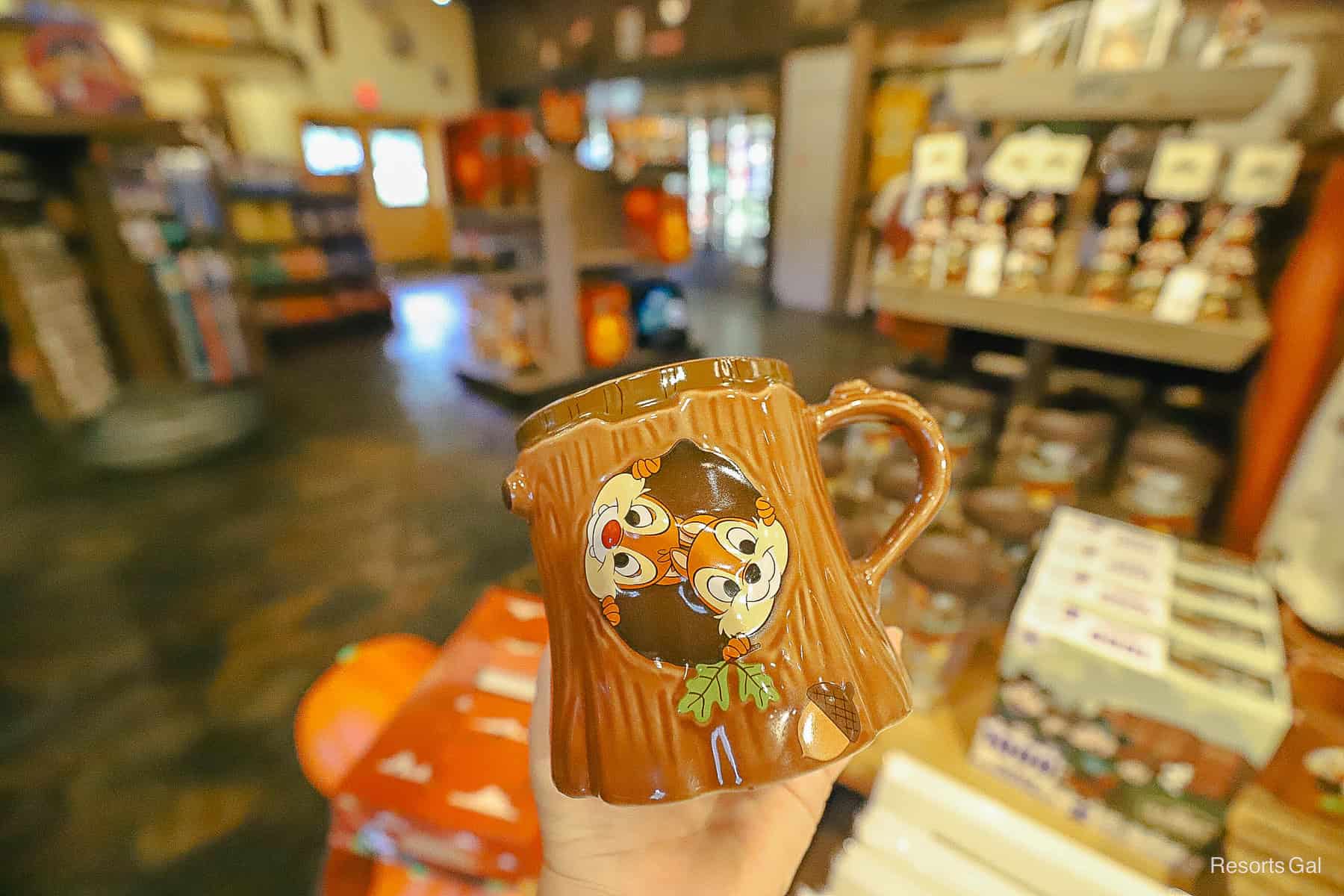 the back side of the mug with Chip and Dale peeping out of a hole in the tree