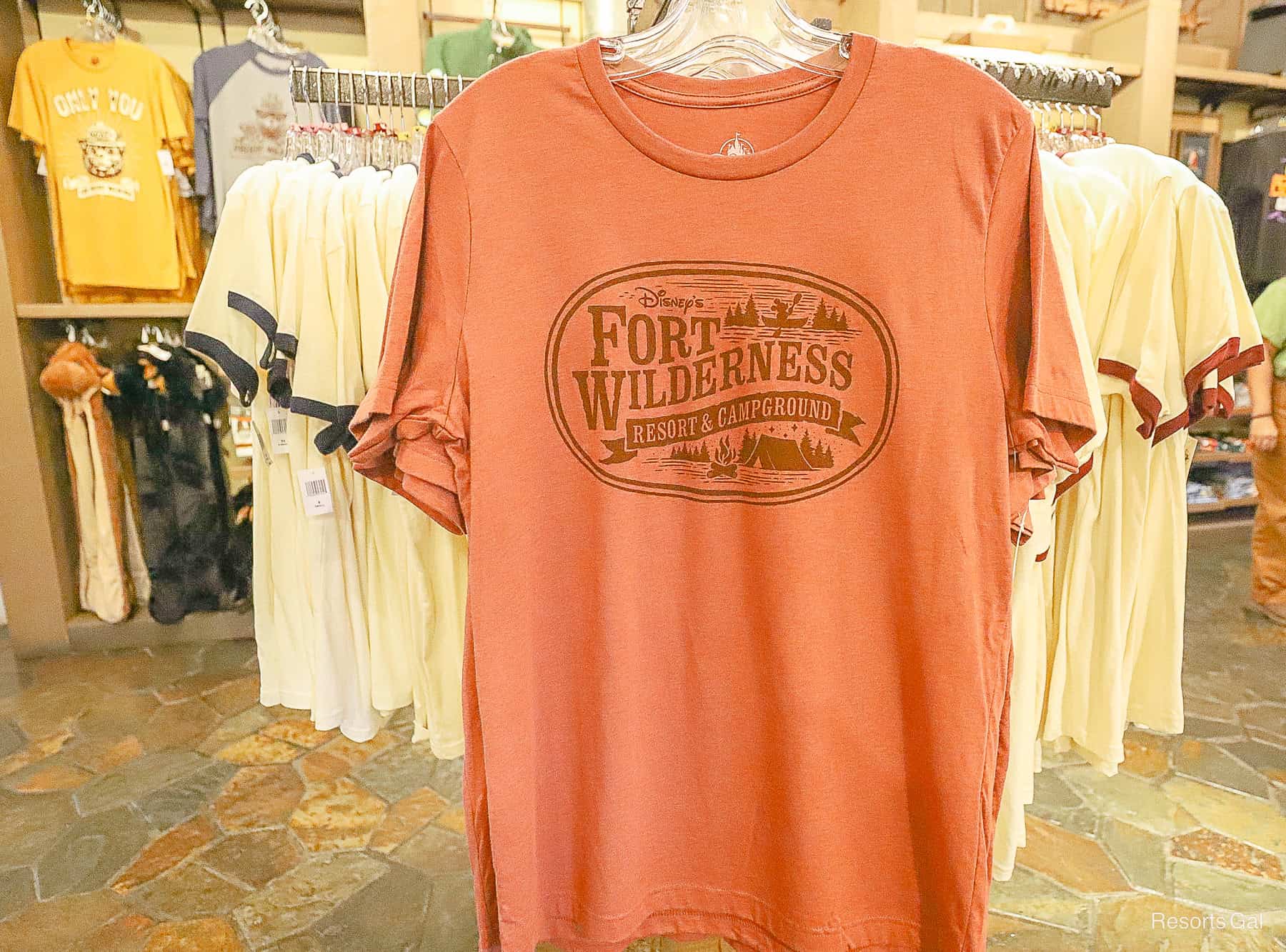 a burnt orange t-shirt with the Fort Wilderness logo