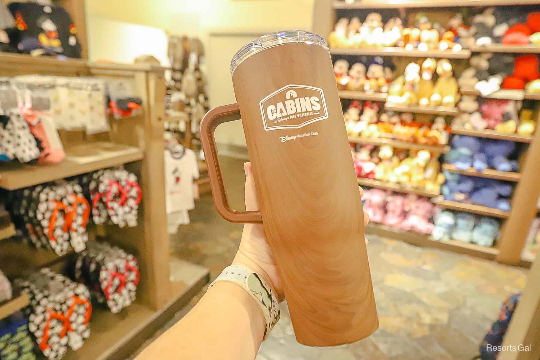 a brown tumbler with handle that says the Cabins at Fort Wilderness