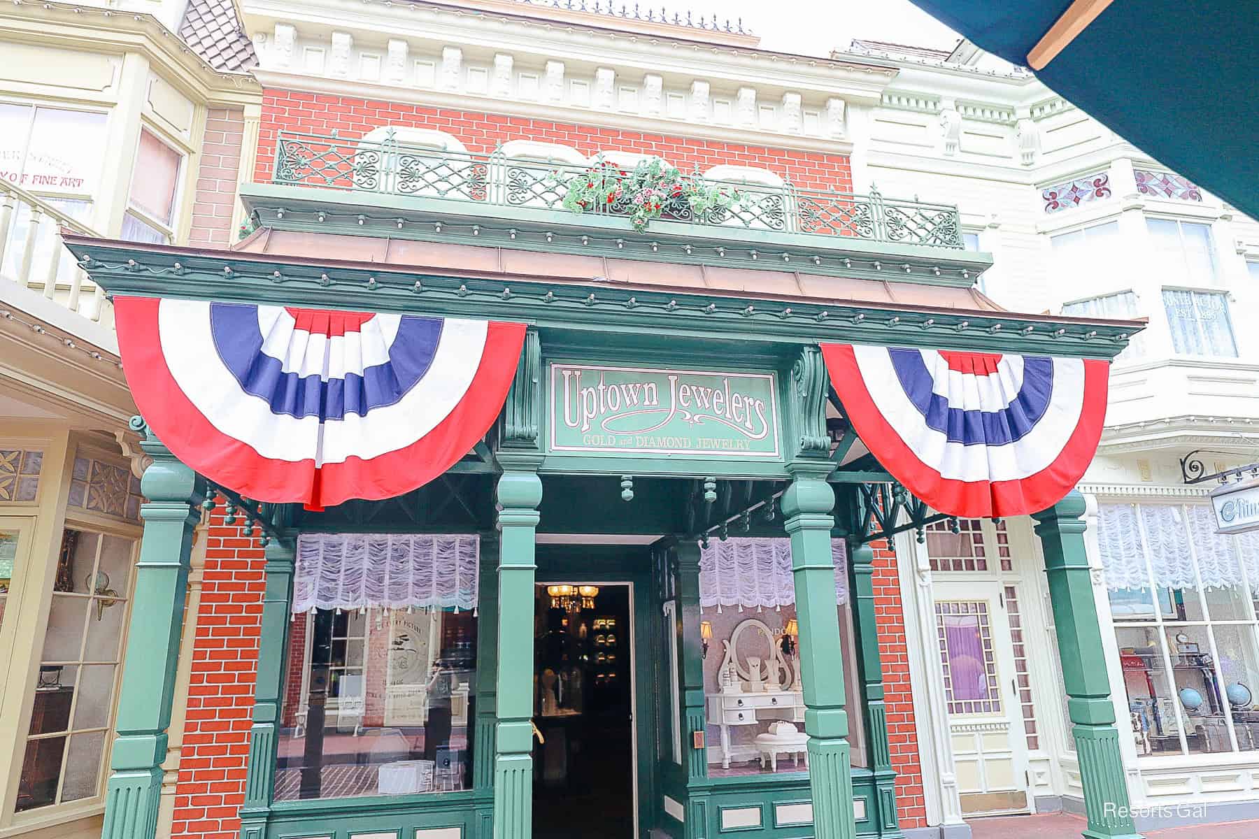 bunting on both sides of the signage in red, white, and blue 