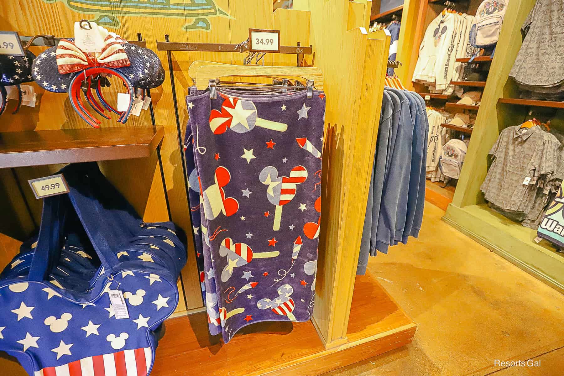a beach towel with Mickey shaped popsicles in red, white, and blue 