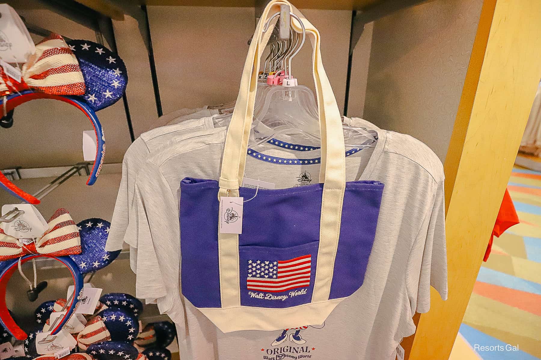 a blue canvas tote with the Walt Disney World logo and American flag 