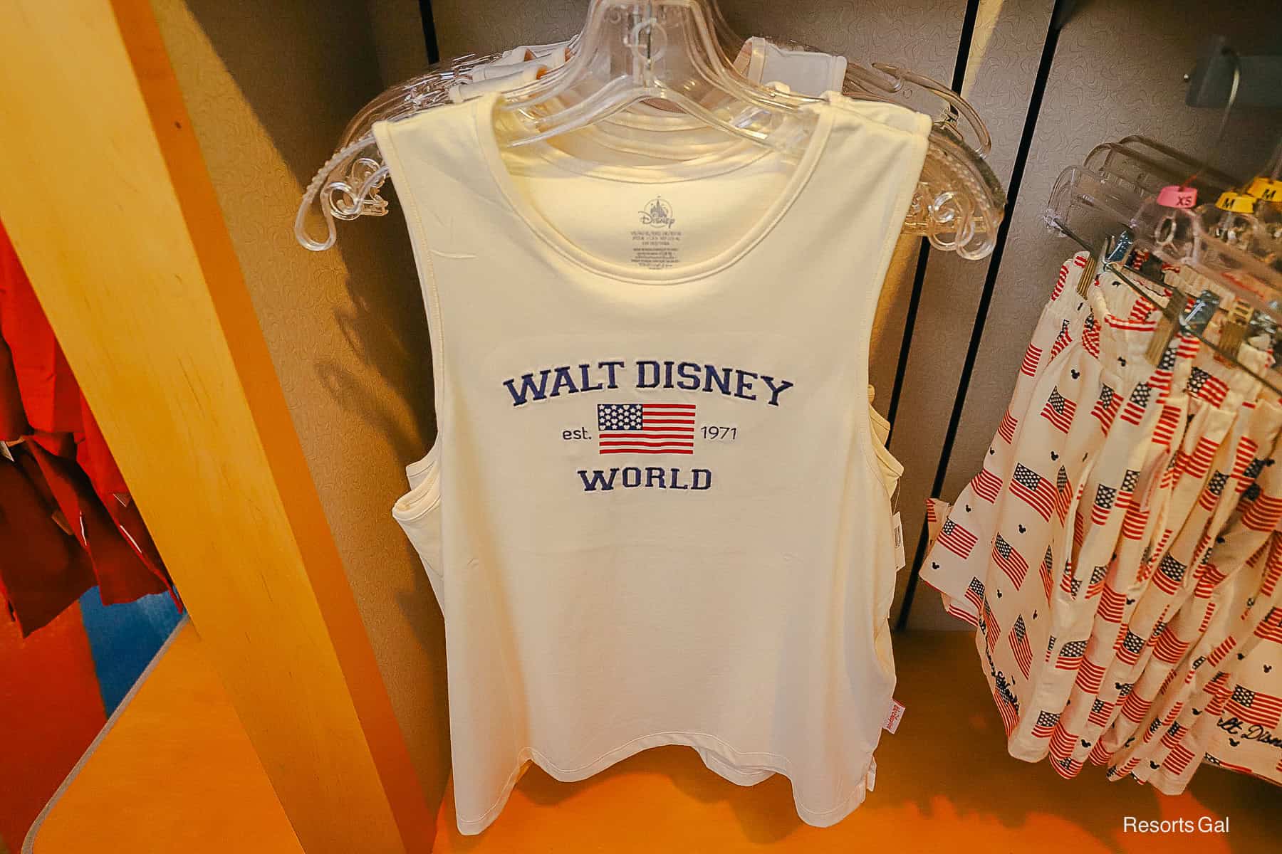 a white tank top with Walt Disney World logo and American flag 