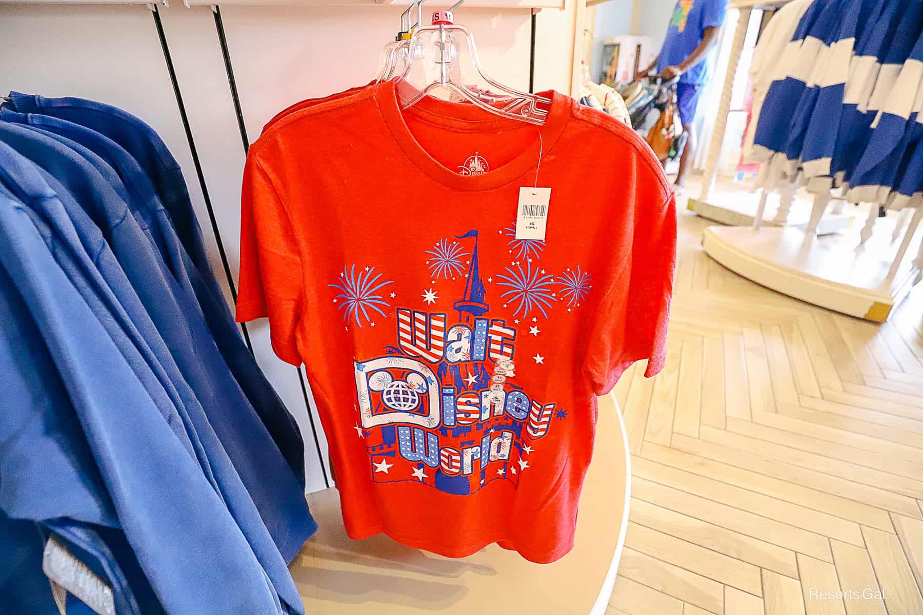 a red Fourth of July shirt with Walt Disney World in white and blue 