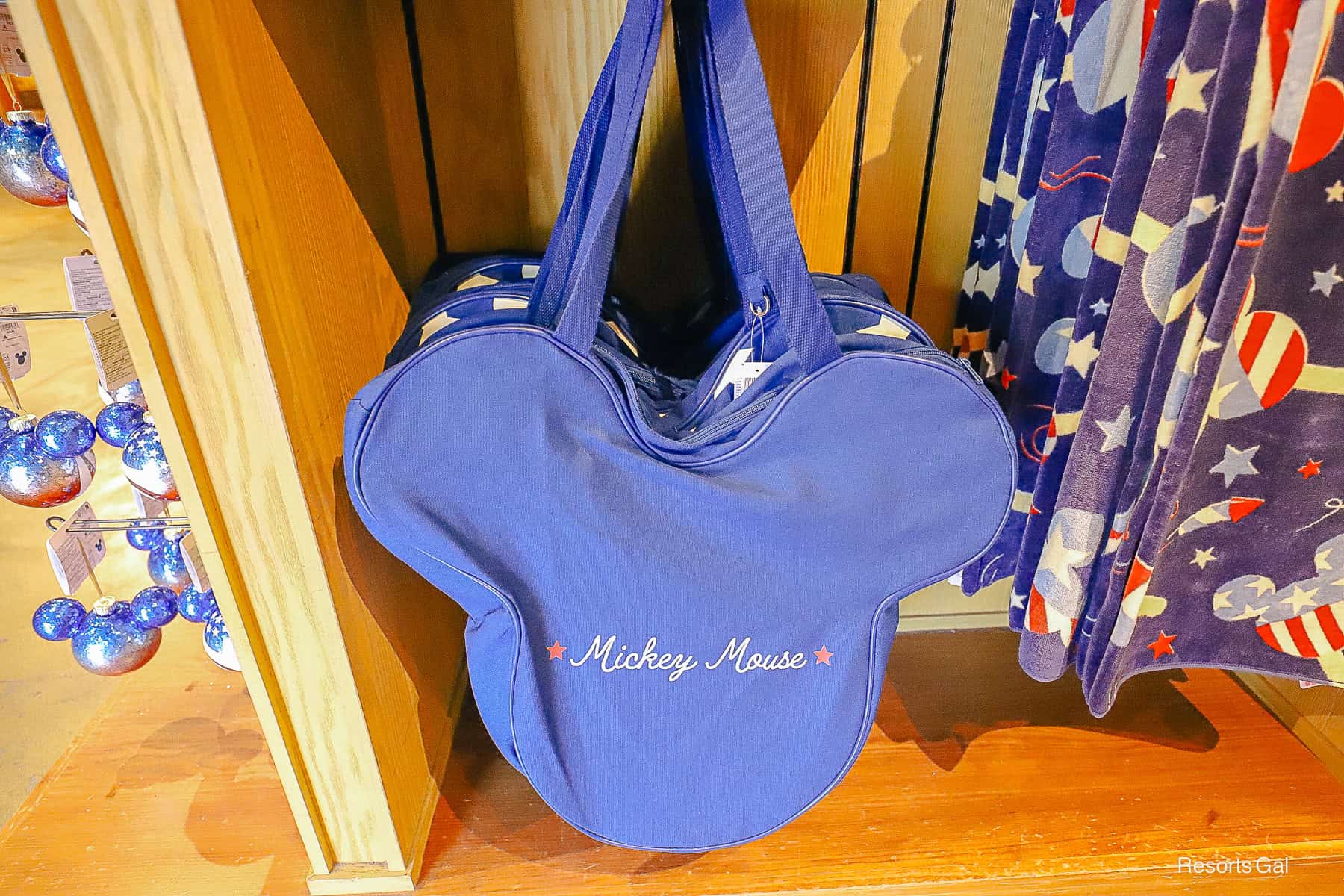 back side of the blue Mickey shaped tote with Mickey Mouse in white and two red stars 