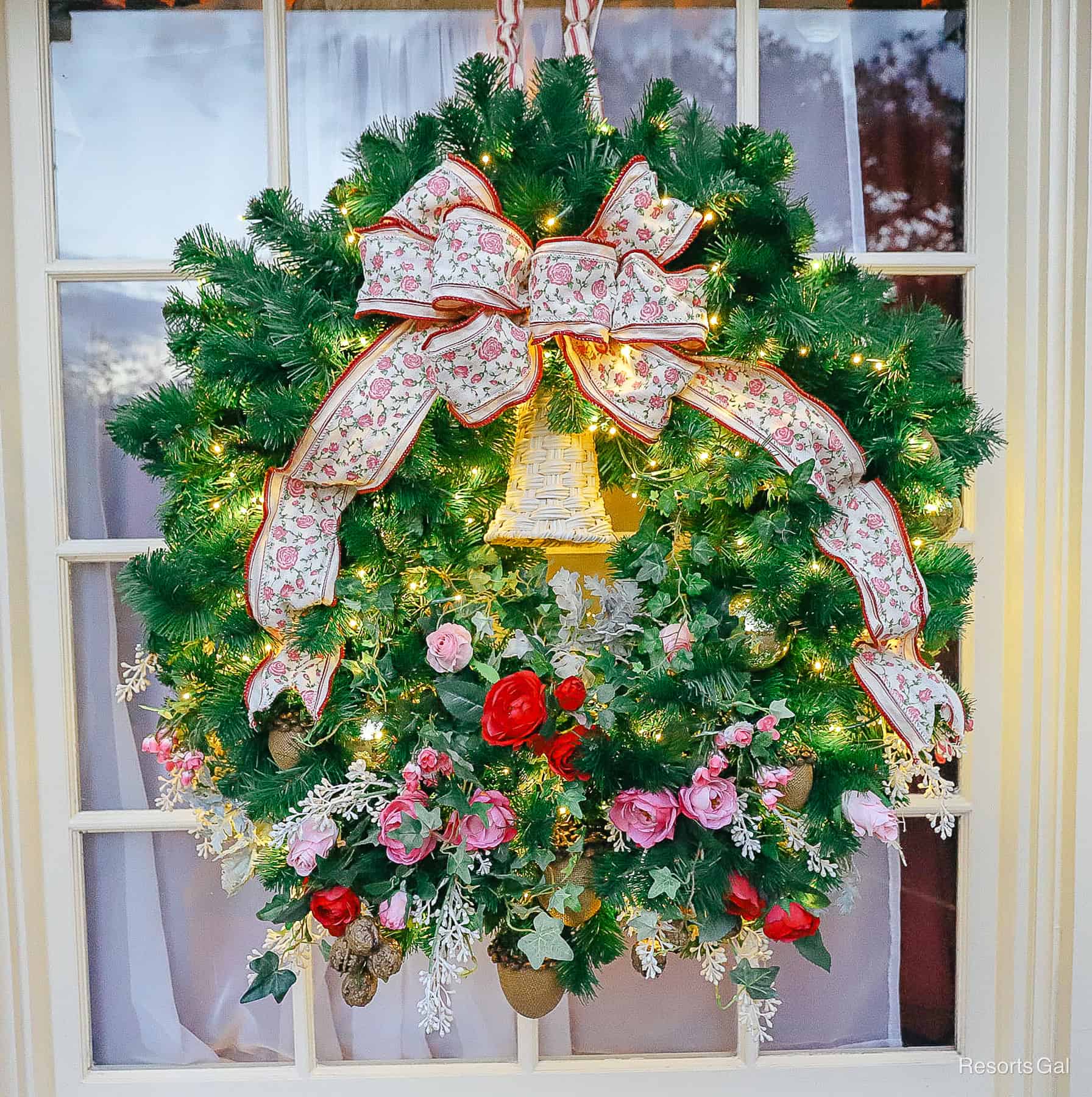 a wreath with a pretty pink rose ribbon and a nod to Victorian times 