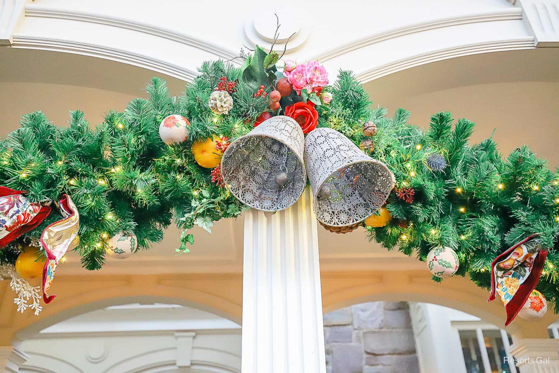 a closeup of the woven bells and other decorations in the pretty garland 