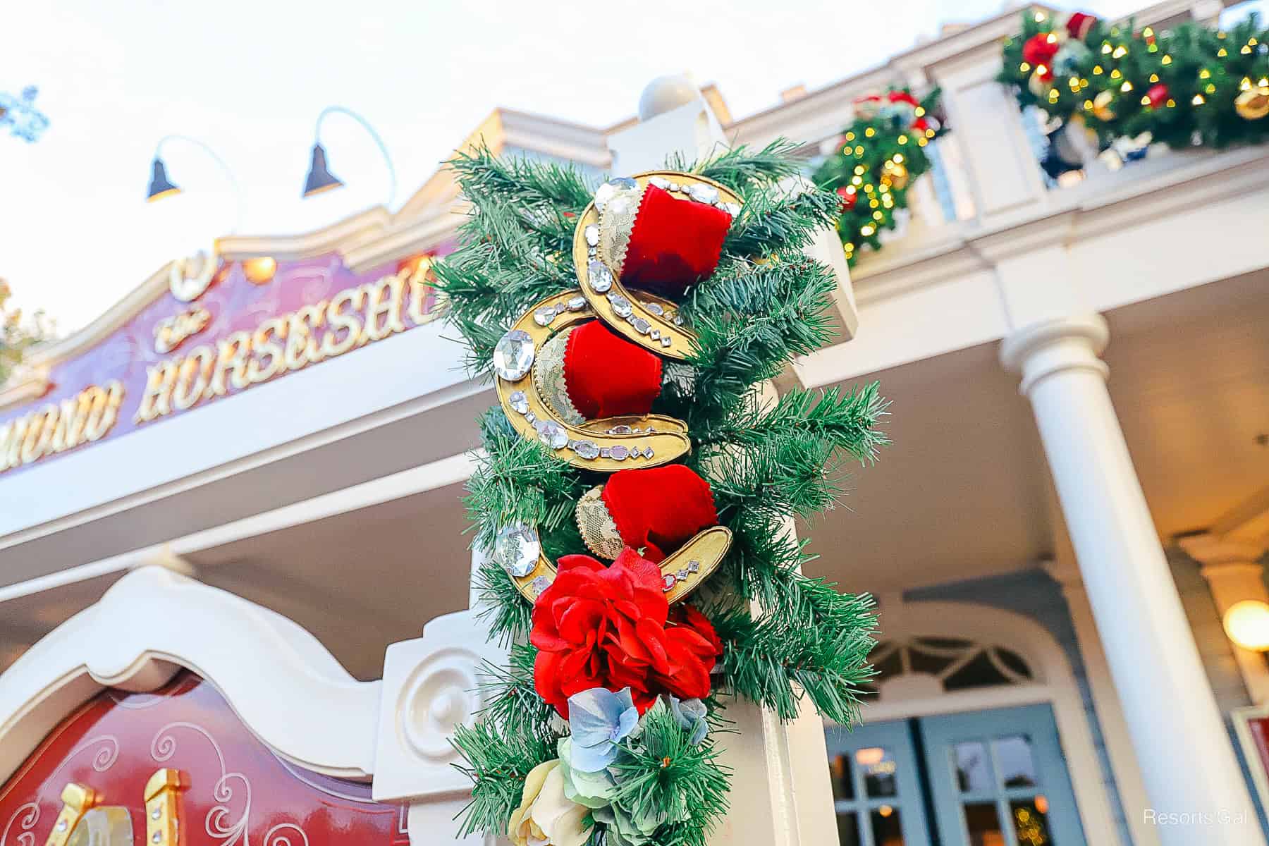 closeup of the horseshoes wrapped in red ribbon 