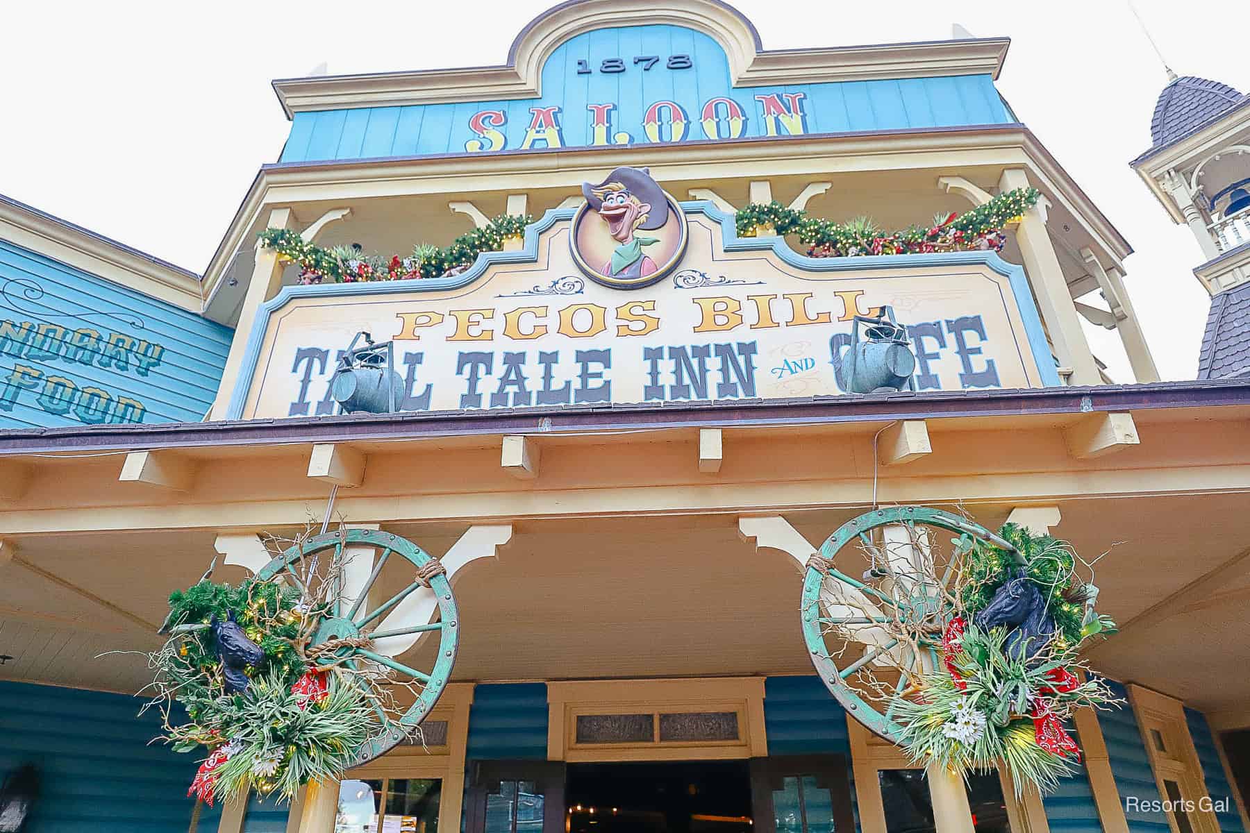 two spoke wheels with iron horses and holiday flors 
