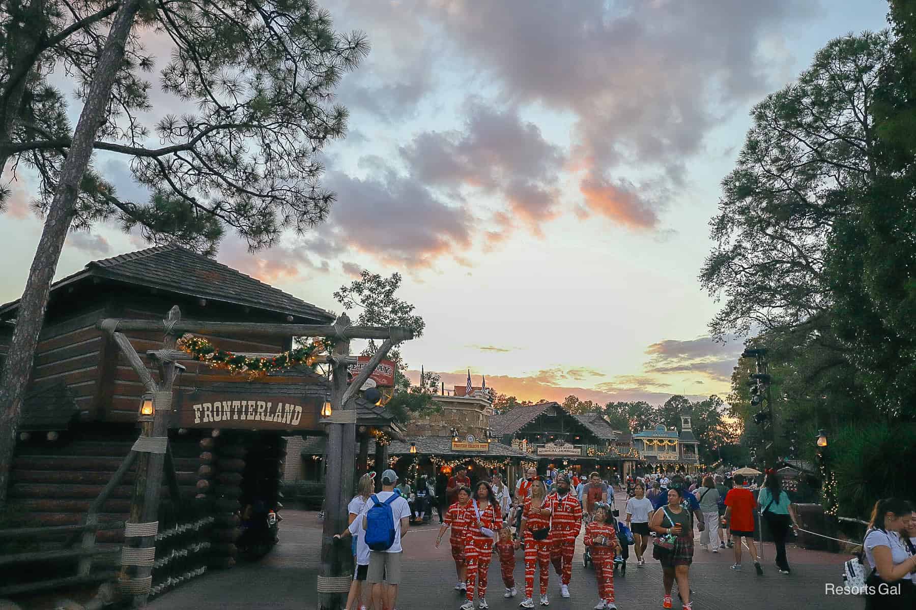 sunset with Christmas decorations in the Frontierland and Liberty Square sections of Magic Kingdom 