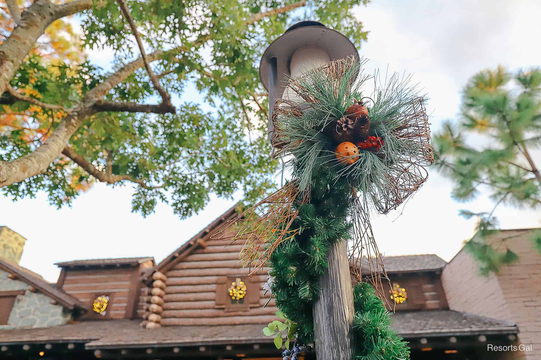 a lamp post in Frontierland decorated with garland 