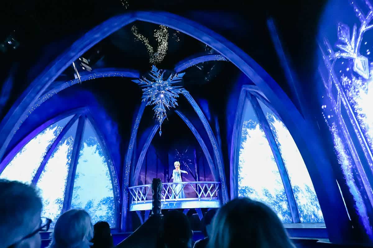 Elsa sings "Let it Go" as she sends guests sailing away in the boat on the Frozen Ever After ride. 