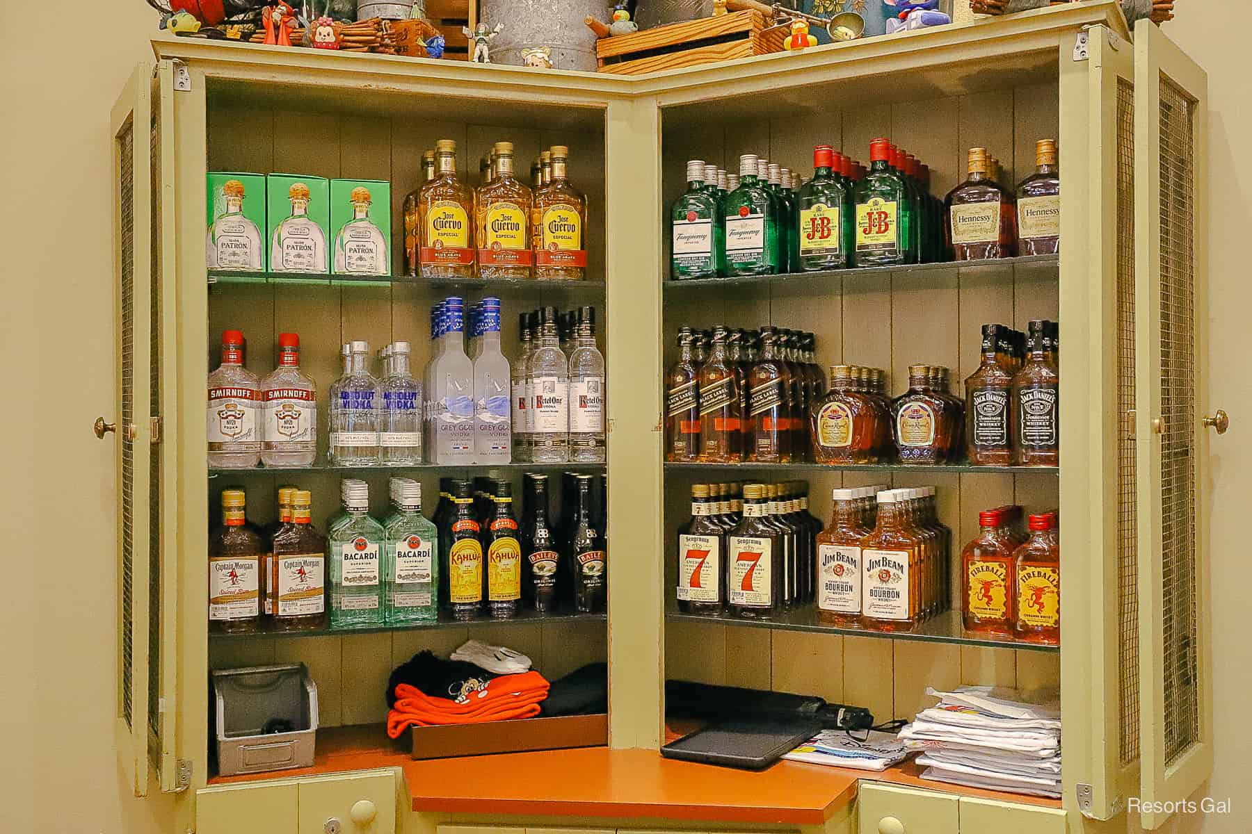 a display case with liquors behind the register 