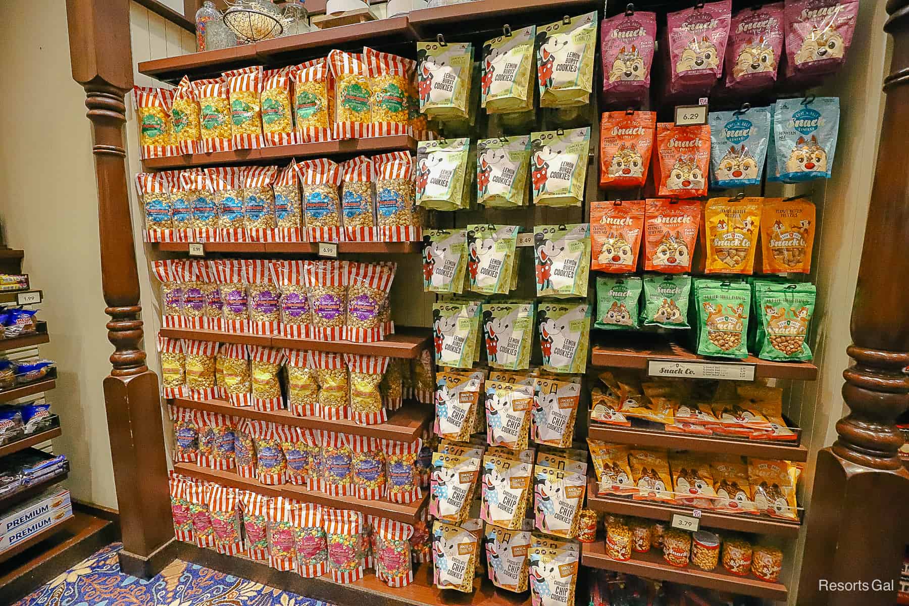 A full wall of Disney branded popcorn and snacks 