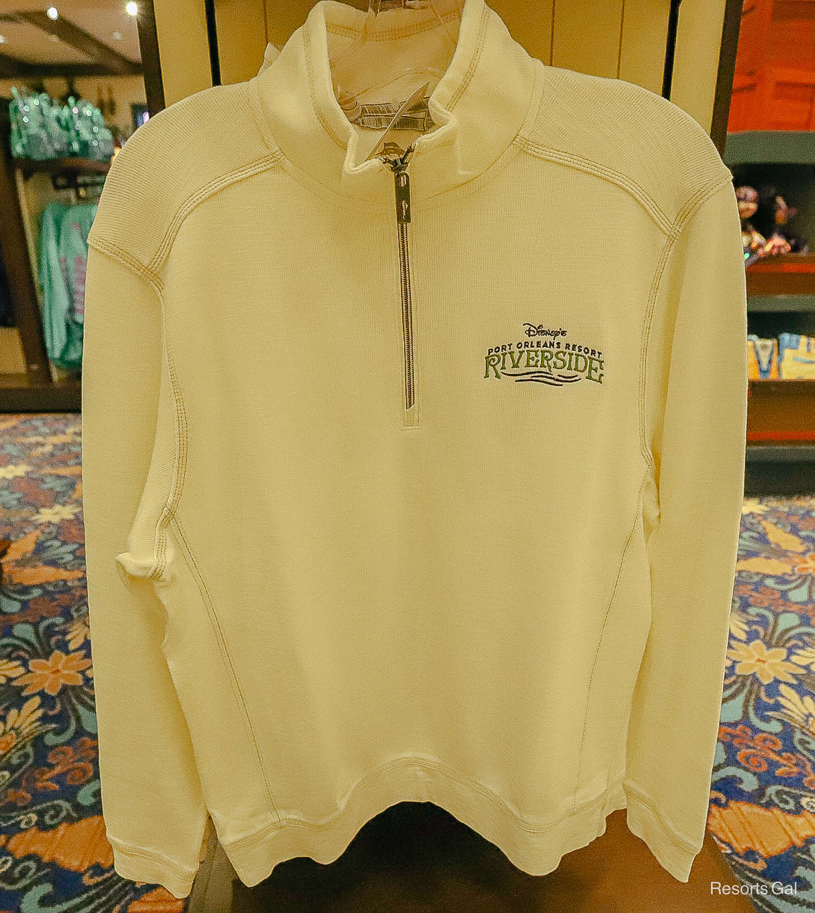 a pullover sweater with the Port Orleans Riverside logo 