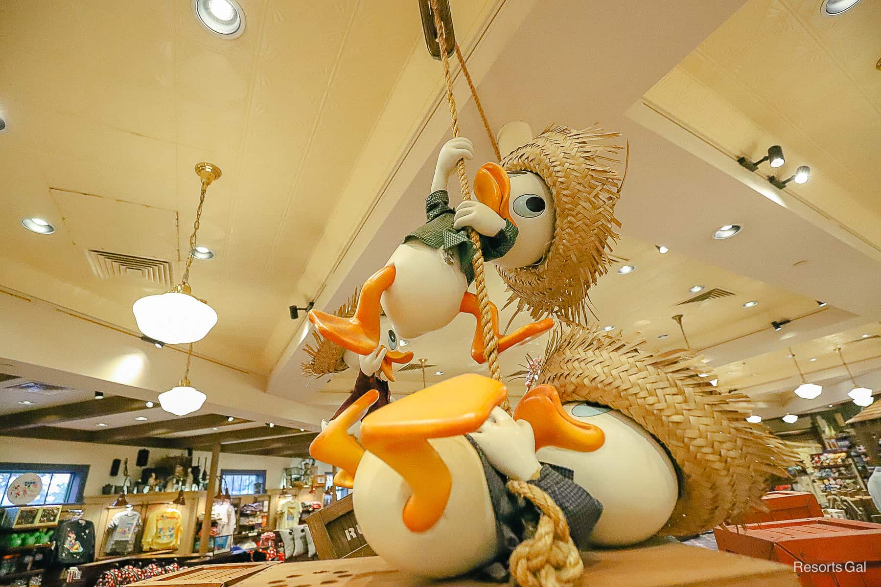 a themed area of Port Orleans Riverside Gift Shop with Donald's newphews wearing gardening hats 