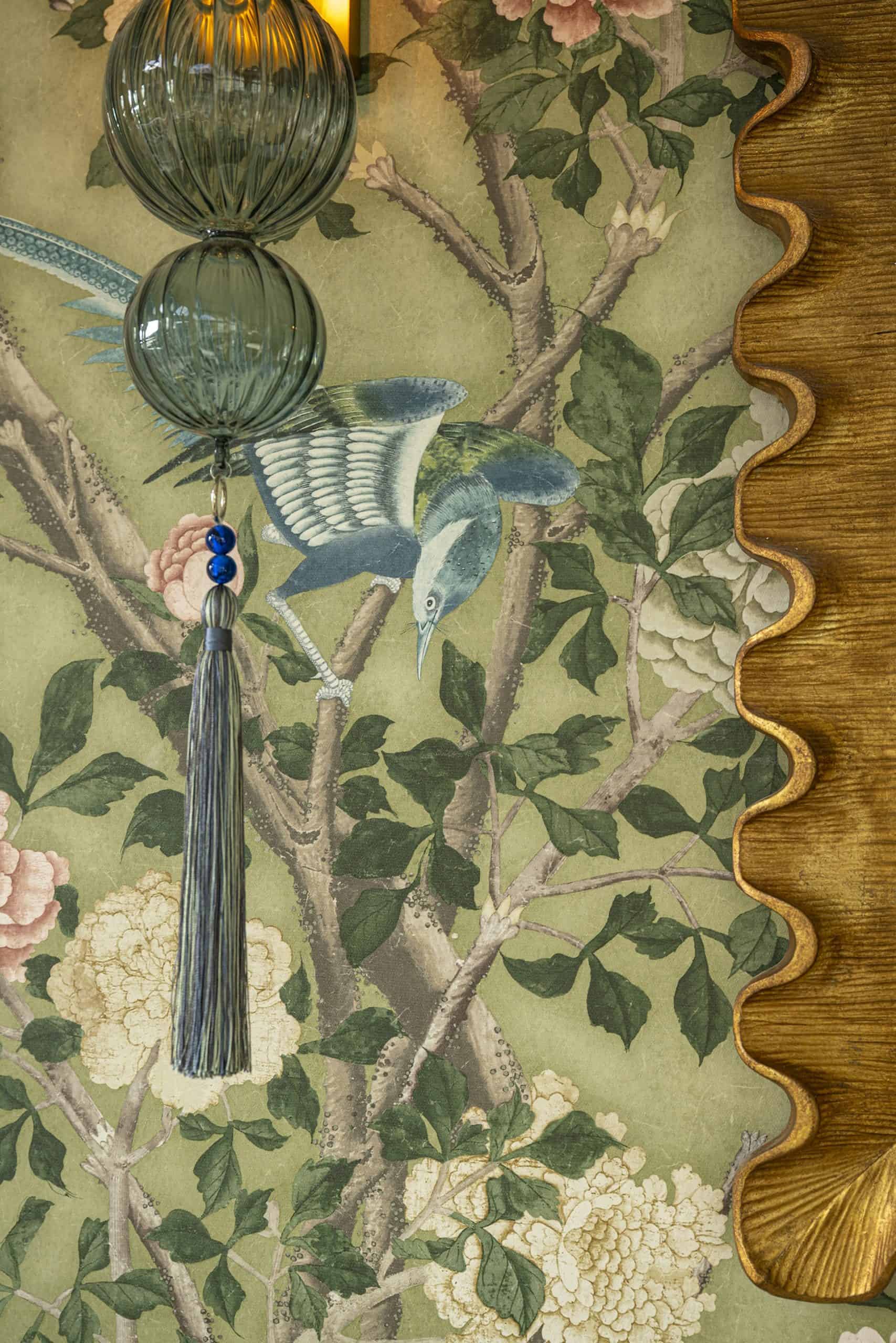 a closeup of a tapestry that hangs in the lounge