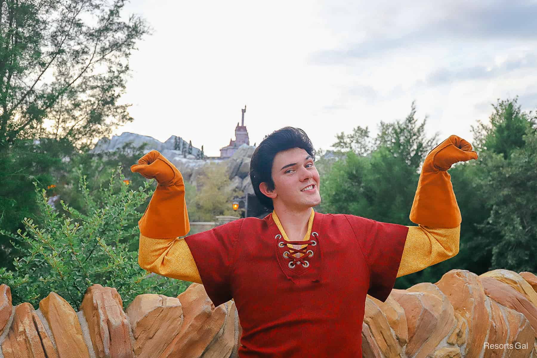 Gaston with a fist pose in front of Beast's castle.