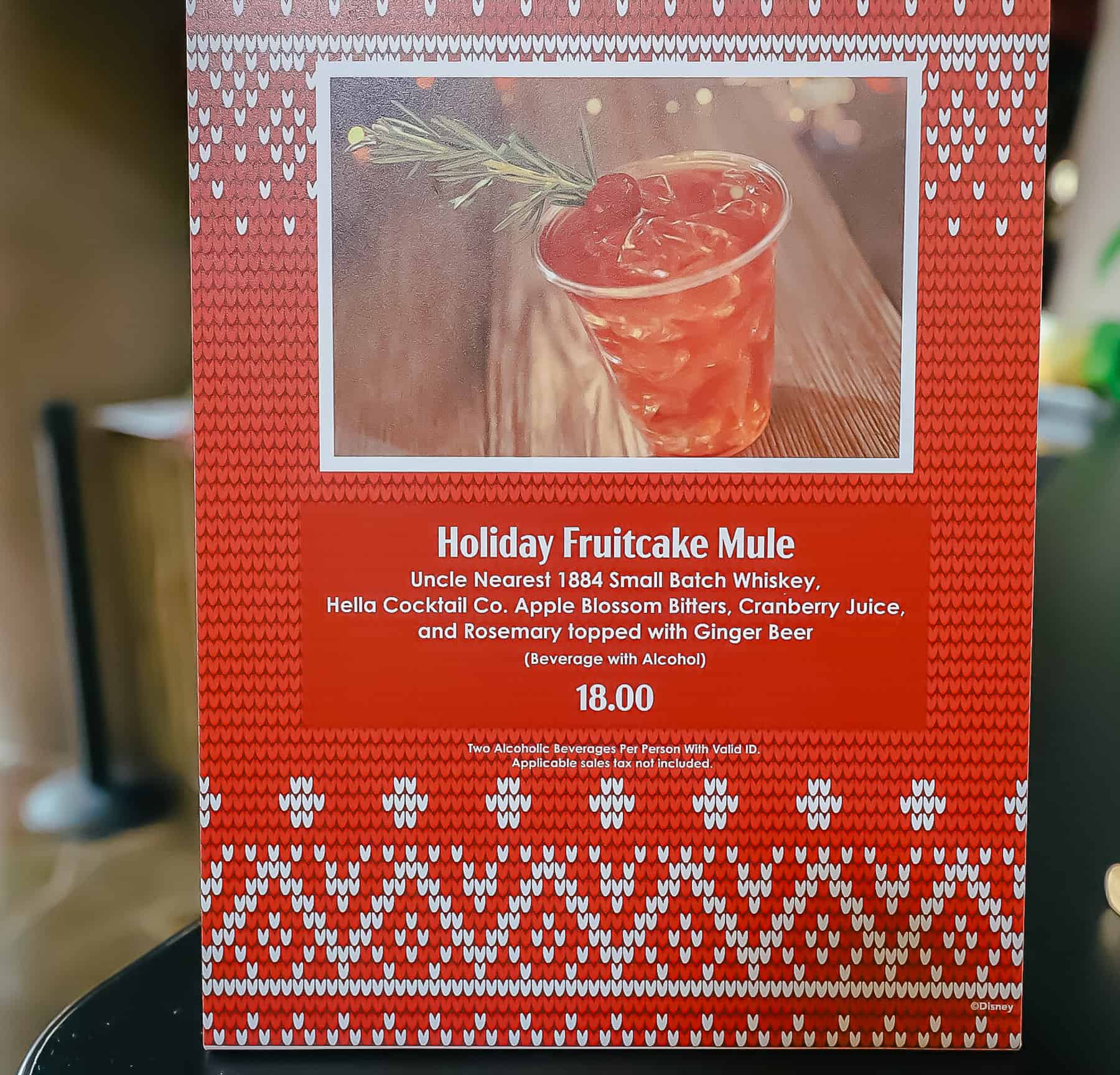 gingerbread animal kingdom lodge cocktail seasonal sign advertising the Holiday Fruitcake Mule for $18.00