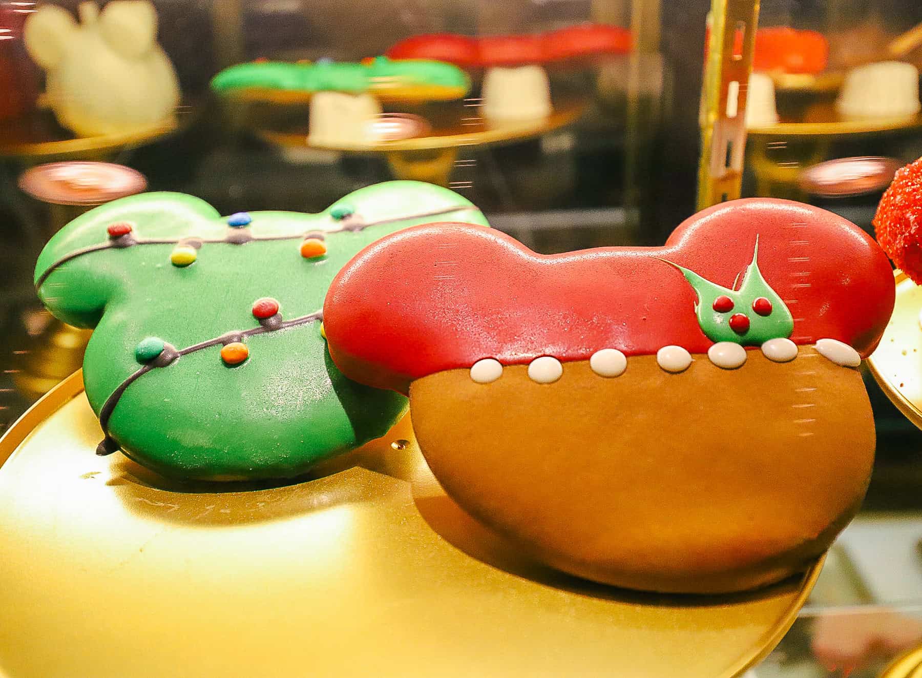 two giant holiday cookies sitting on a tray 