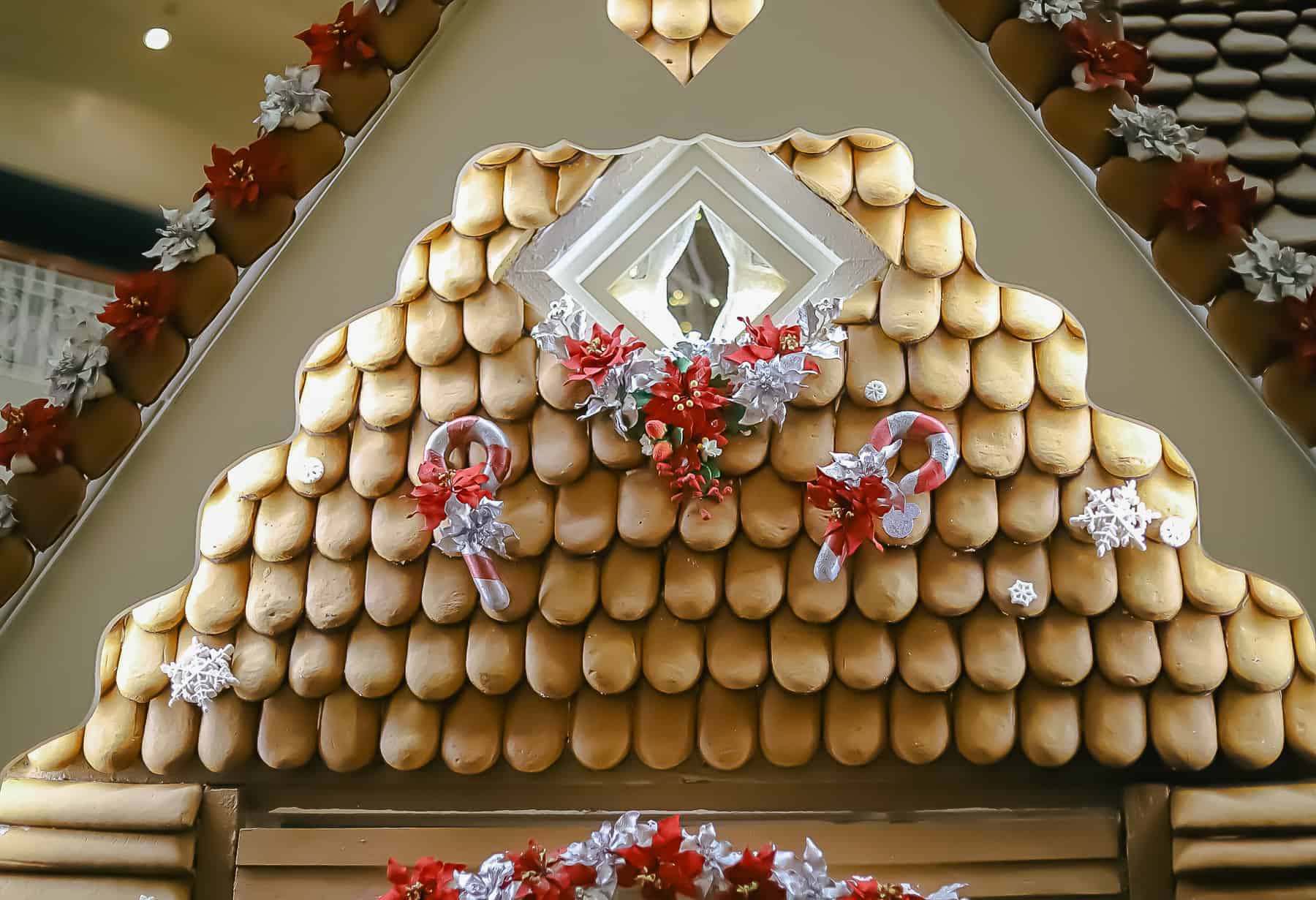 window with curtains drawn, decorative elements line candy canes and snow flakes