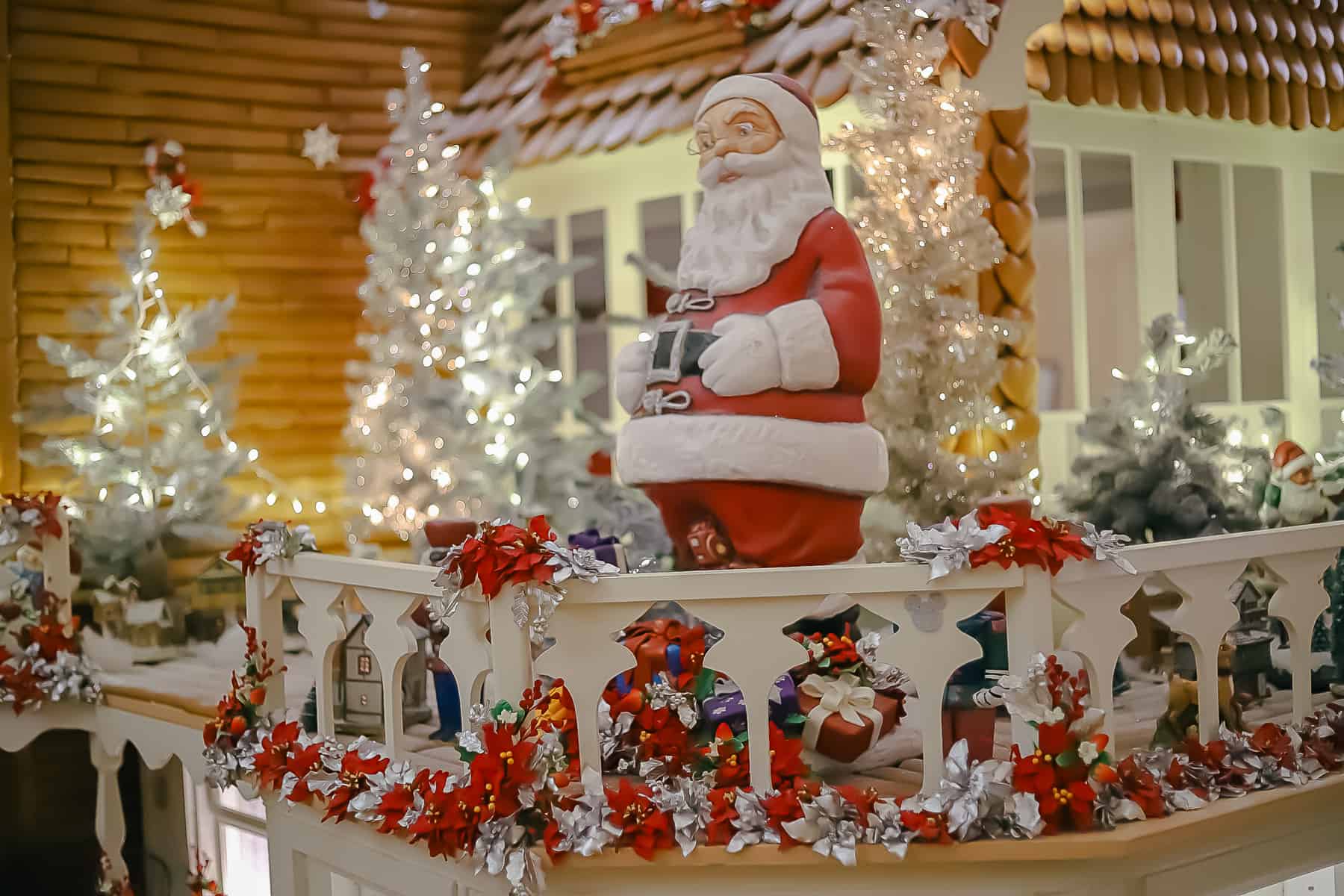 85 lb chocolate Santa on the porch of the gingerbread house