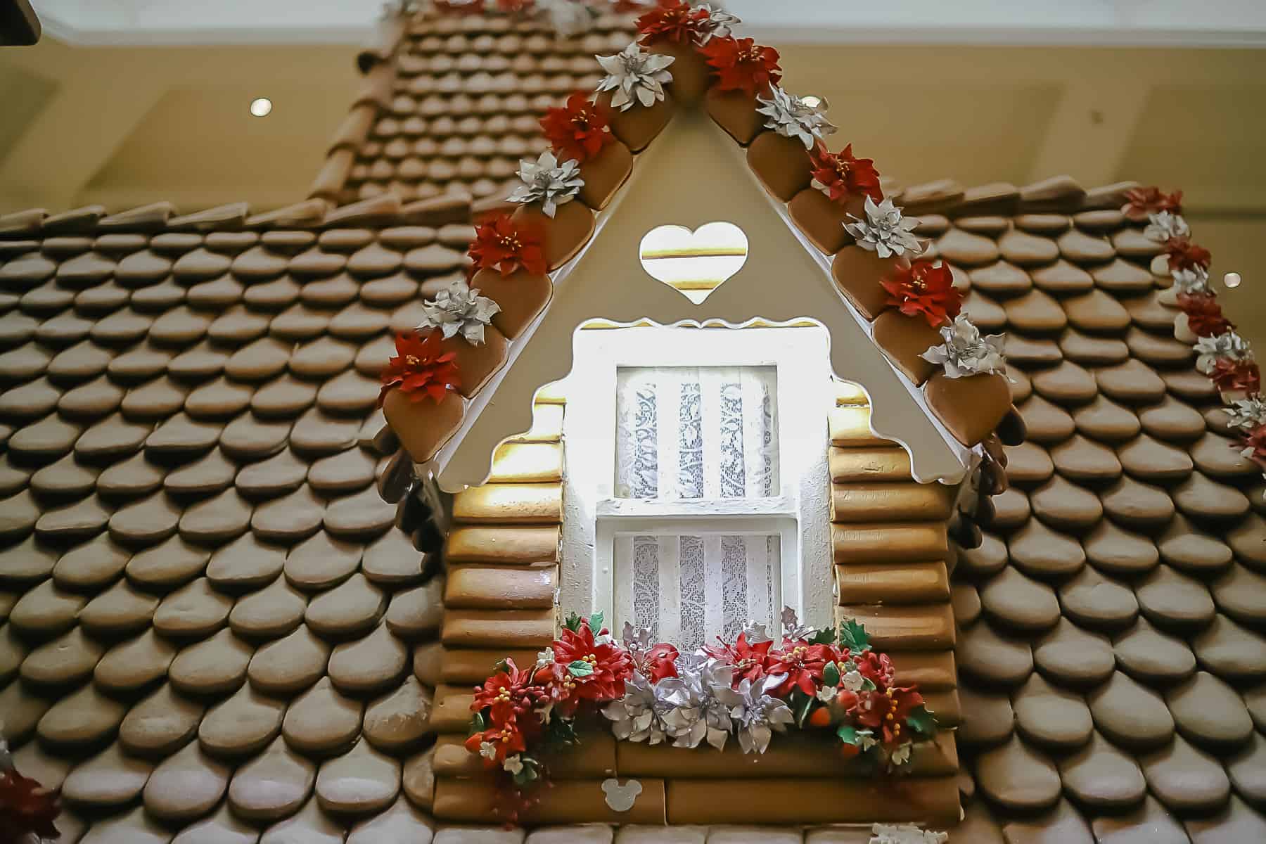 lace curtains, a heart shaped decorative window, and a hidden Mickey