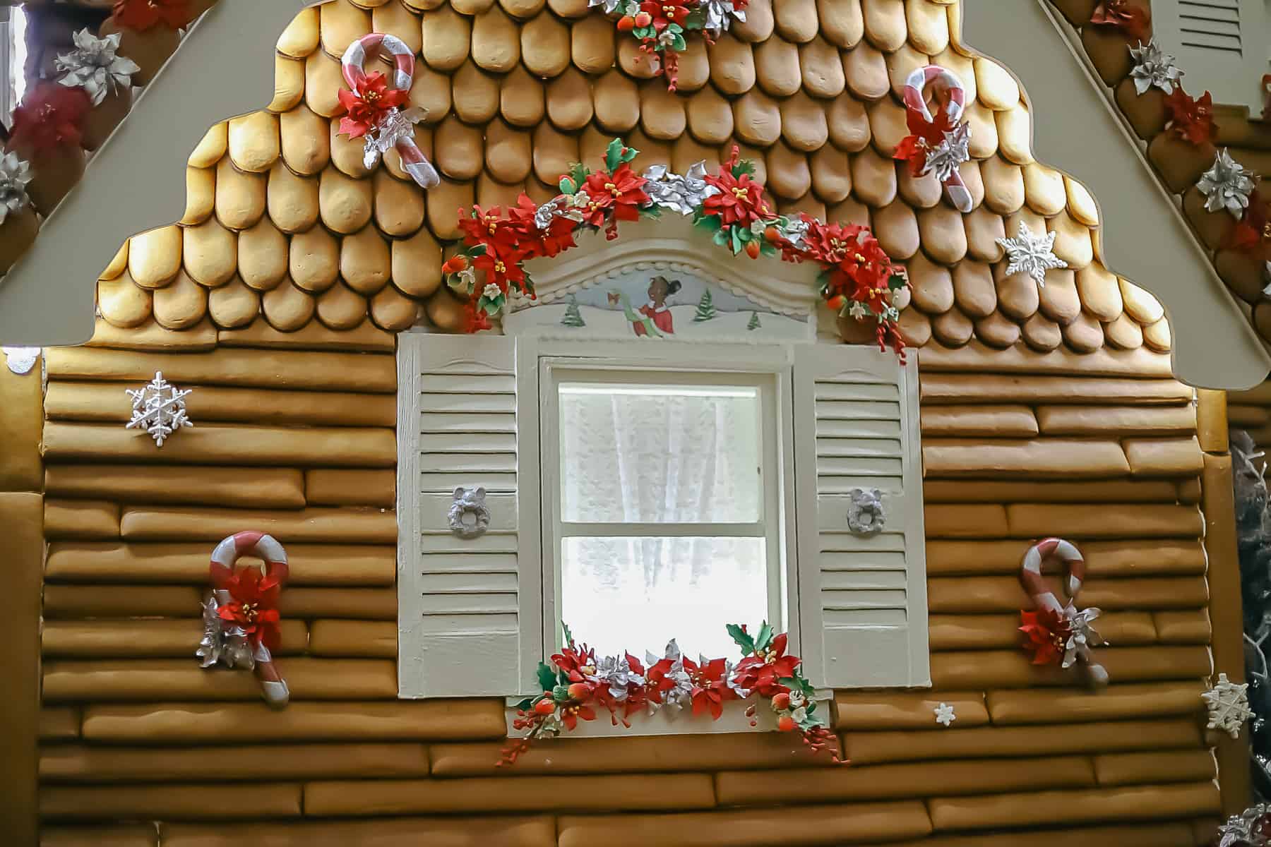 Tiana airbrushed over the window sill of the gingerbread house. 