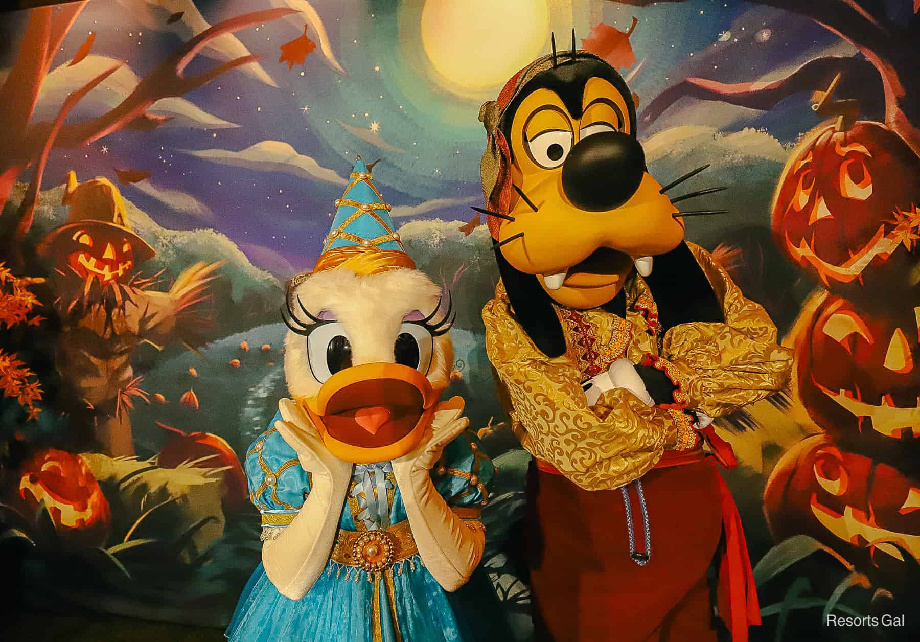 Goofy and Daisy smile for a closeup in their Halloween costumes 