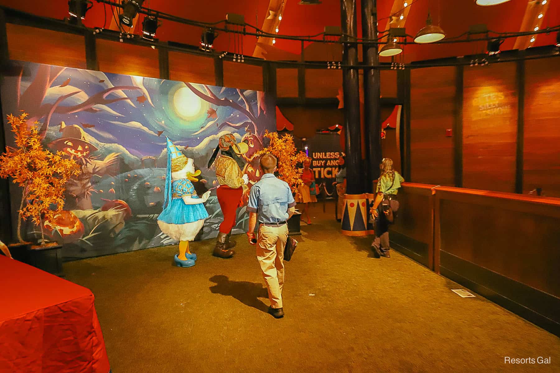 a PhotoPass photographer and character attendant at the meet-and-greet 