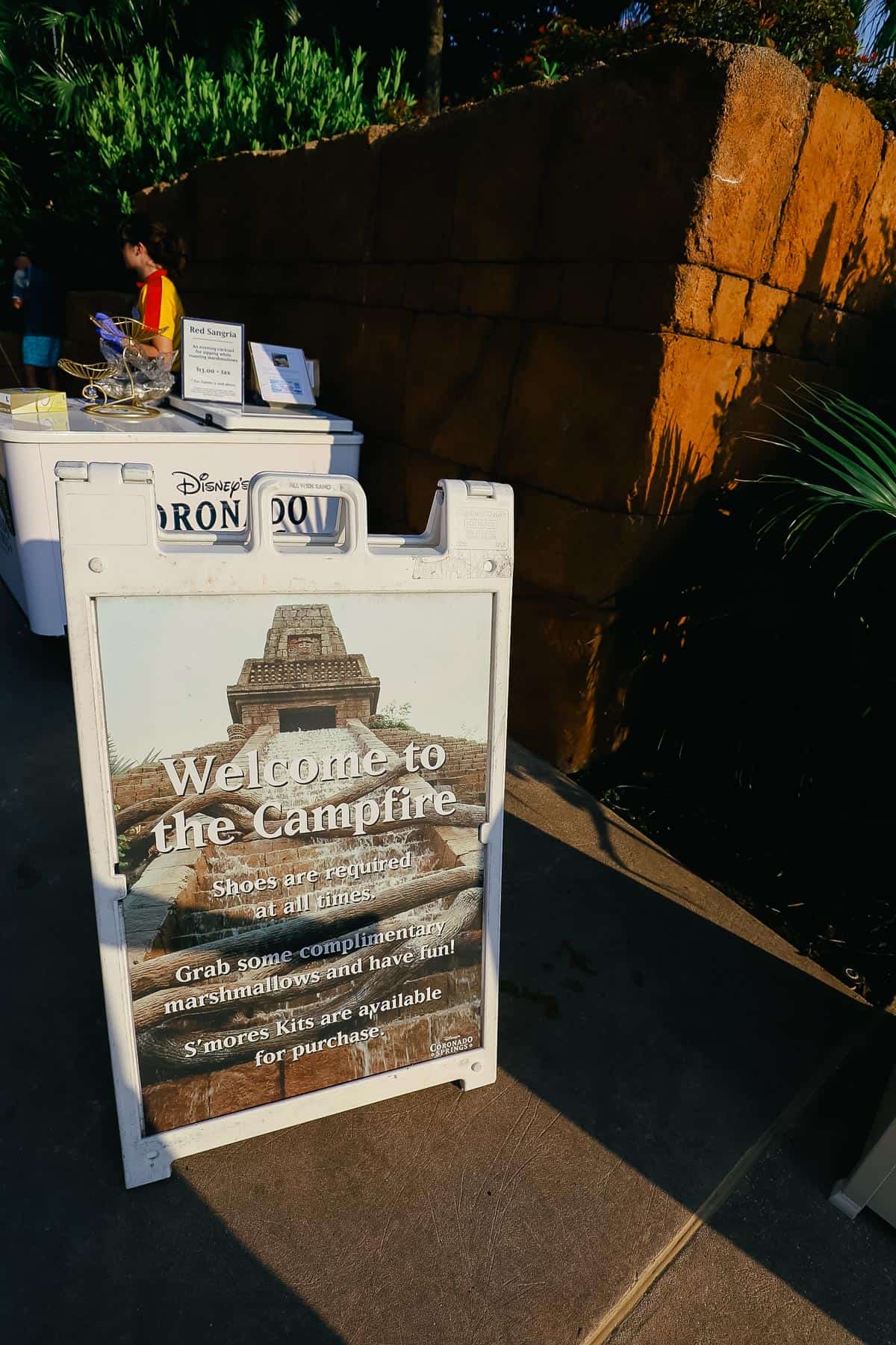 a sign that says welcome to the campfire and invites guests to enjoy complimentary marshmallows 