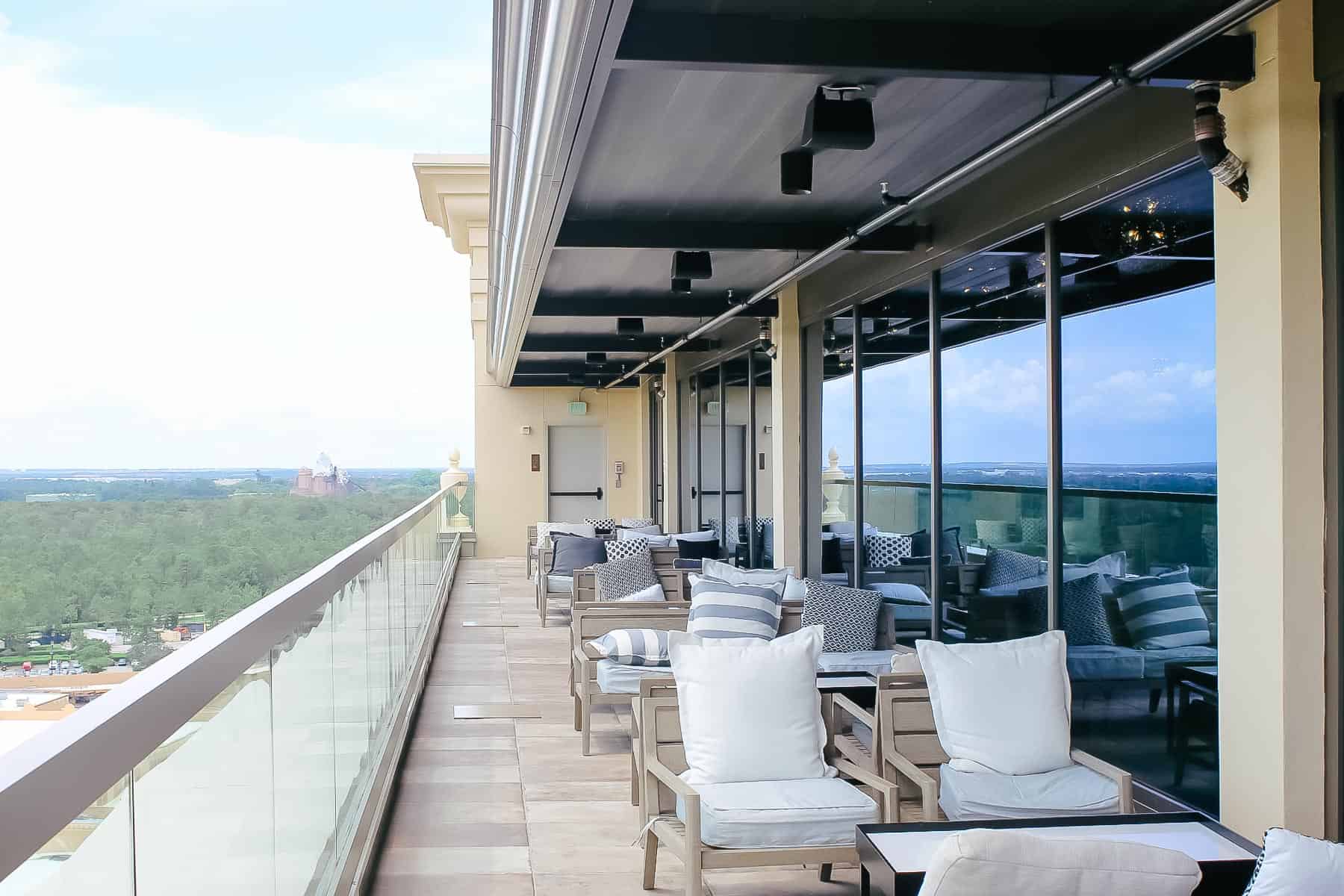 a deck on Gran Destino Tower with multiple seating arrangements 